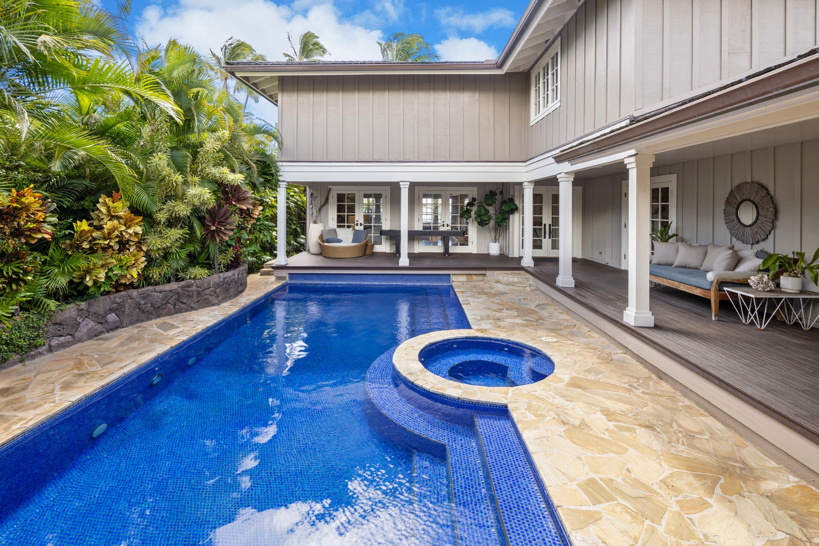 Honolulu Vacation Rentals, Moana Lani - Main House - Float between tropical greenery on one side and the covered lanai on the other.