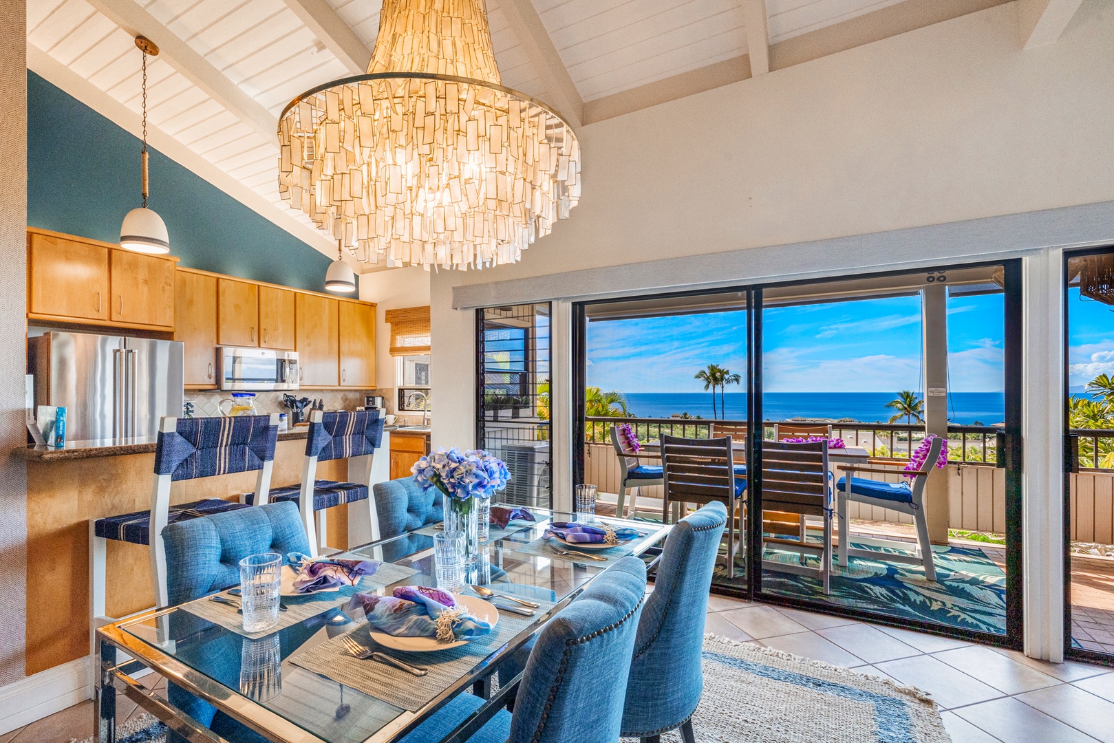 Kihei Vacation Rentals, Wailea Ekolu 1106 - A bright dining area with large windows and ocean views, perfect for enjoying meals with a view.