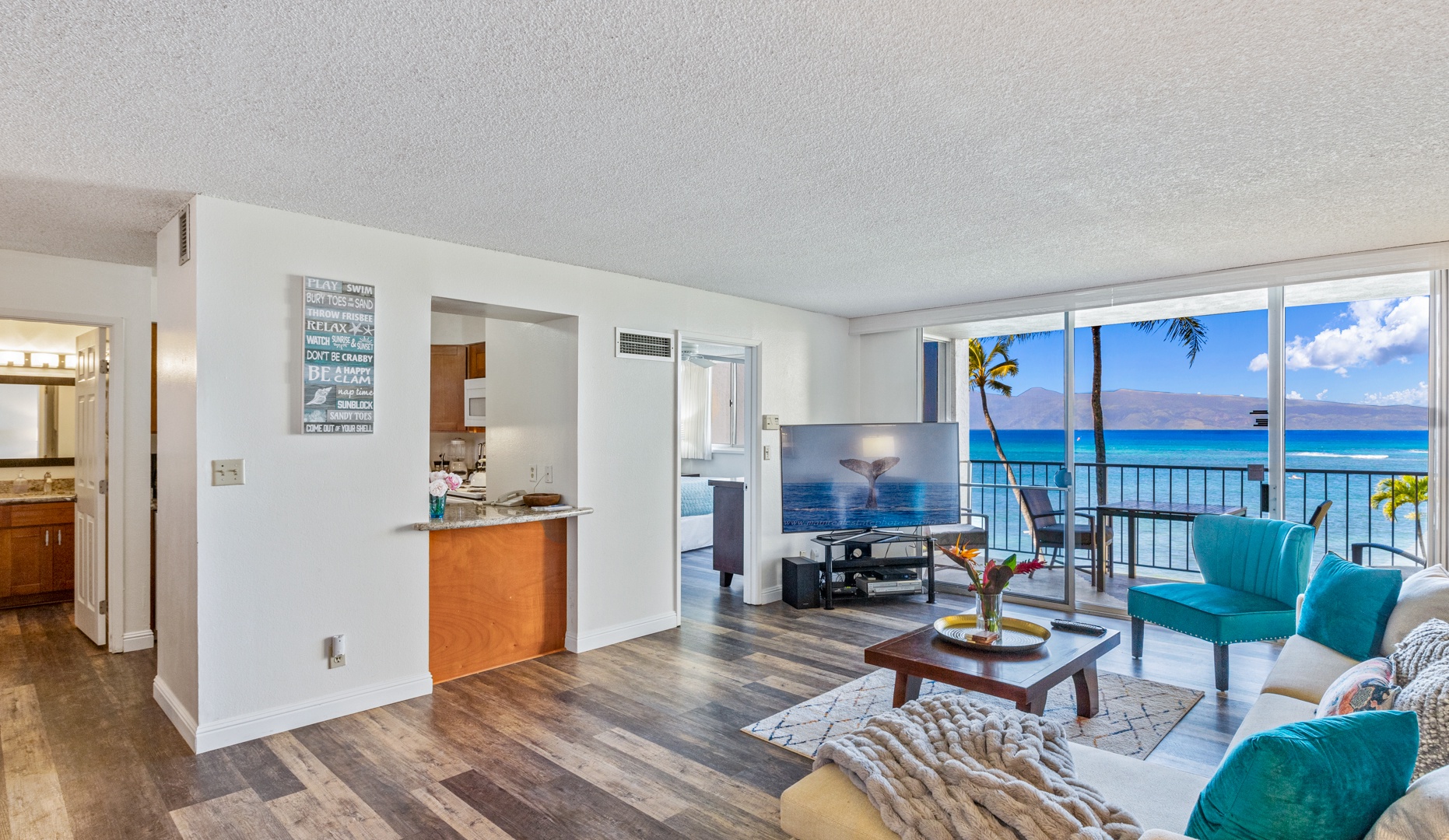 Lahaina Vacation Rentals, Royal Kahana 308 - Natural light floods the living room, with ocean views visible from the adjacent lanai, creating a serene and bright atmosphere for relaxation