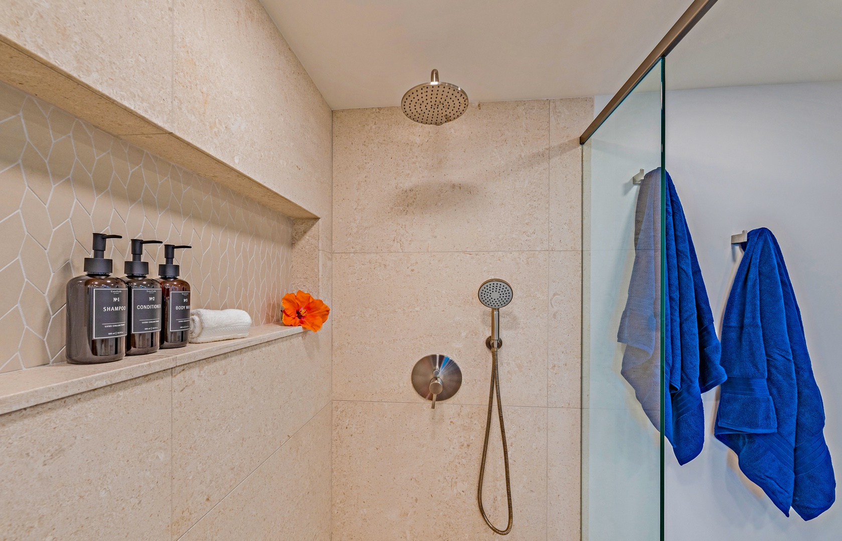 Lahaina Vacation Rentals, Kaanapali Shores 702 - The walk-in shower features sleek tile, a rainfall showerhead, and a convenient built-in shelf for toiletries.