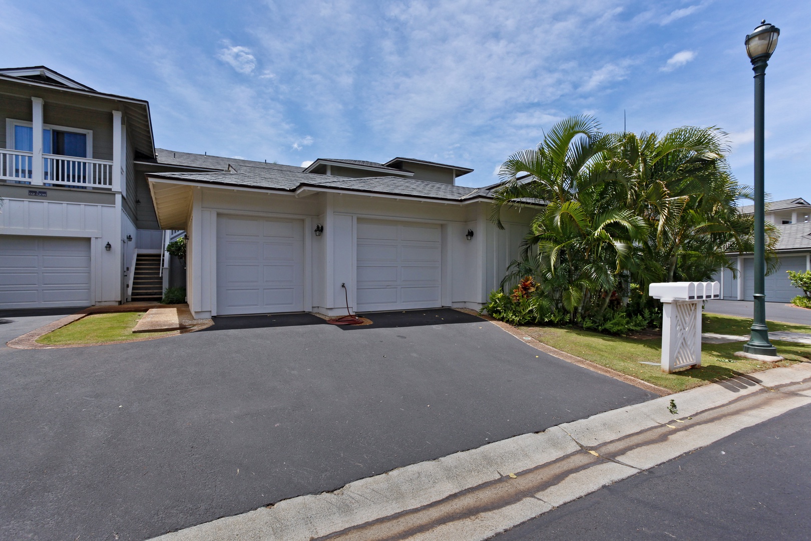 Kapolei Vacation Rentals, Coconut Plantation 1208-2 - The paved area and garage of the condo.