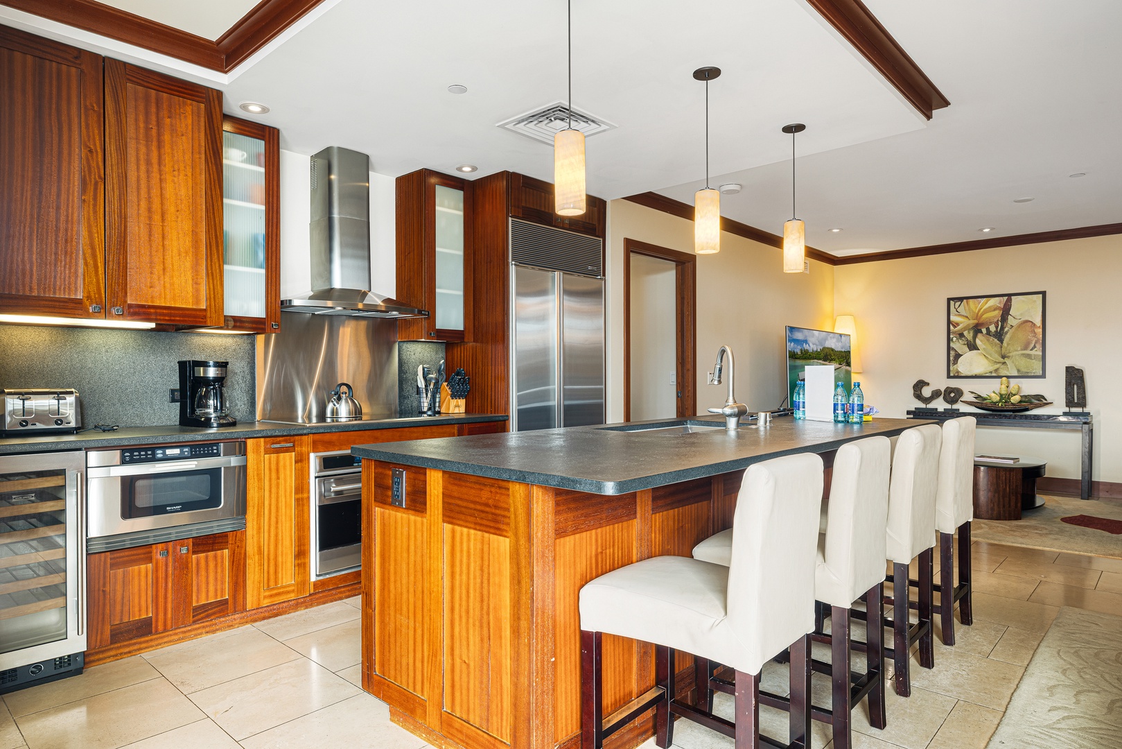 Your gourmet kitchen invites culinary adventures with rich wood cabinetry, sleek granite counters, and top-tier stainless steel appliances. Gather at the spacious island for meals and memories together.