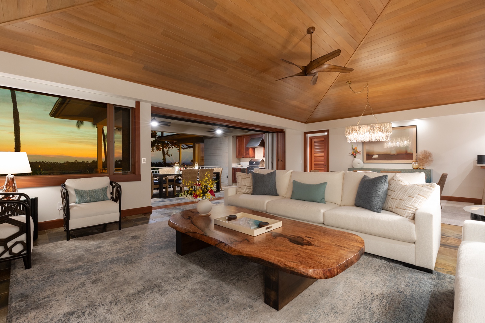 Kailua Kona Vacation Rentals, 3BD Waiulu Villa (111D) at Hualalai Resort - Unwind in your spacious living room with stunning wood ceilings and breathtaking sunset views through floor-to-ceiling windows.