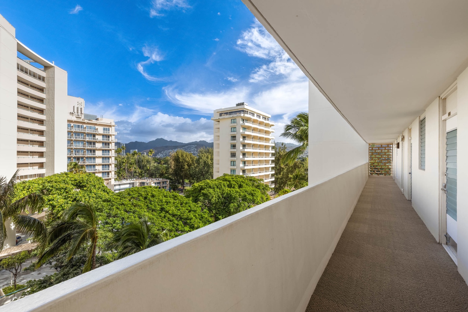 Honolulu Vacation Rentals, Colony Surf Getaway - Urban oasis with a verdant balcony view, offering a serene views from the guest bedroom balcony.