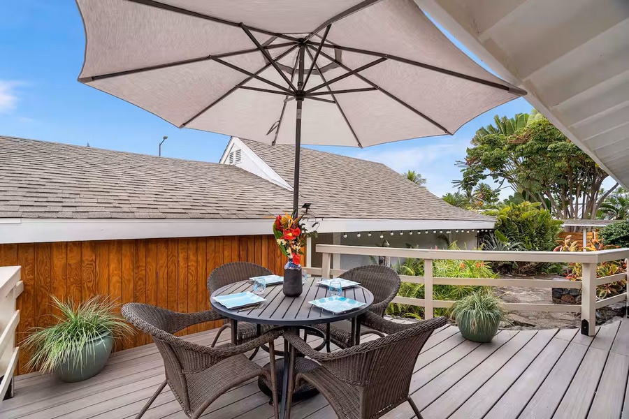 Kailua Kona Vacation Rentals, Manukai Hale - An umbrella shades the deck table, the spot for a slow Kona afternoon.