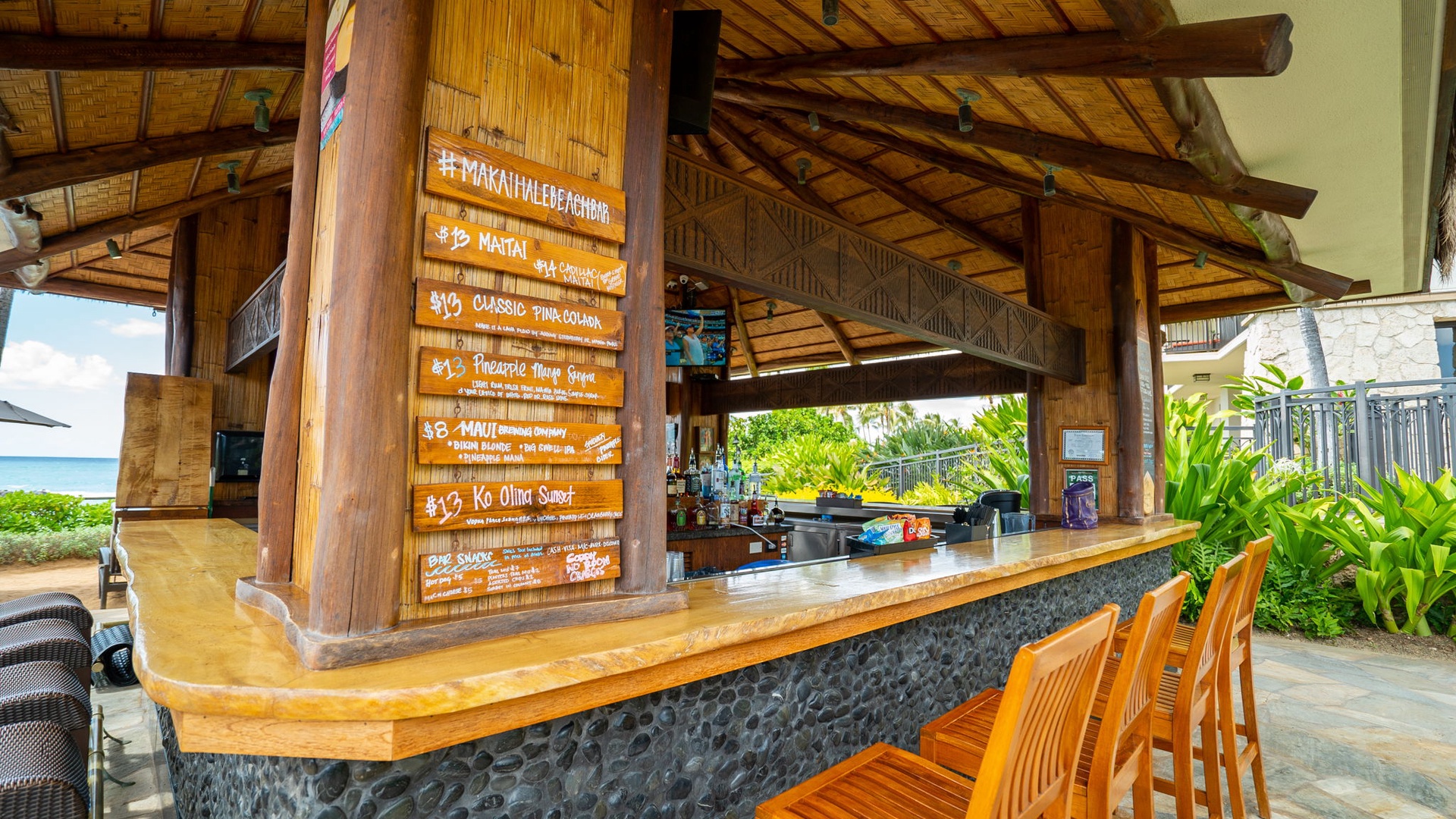 Kapolei Vacation Rentals, Ko Olina Beach Villas B604 - Savor tropical cocktails at the thatched-roof poolside bar, where ocean breezes and island flavors create your perfect vacation escape.