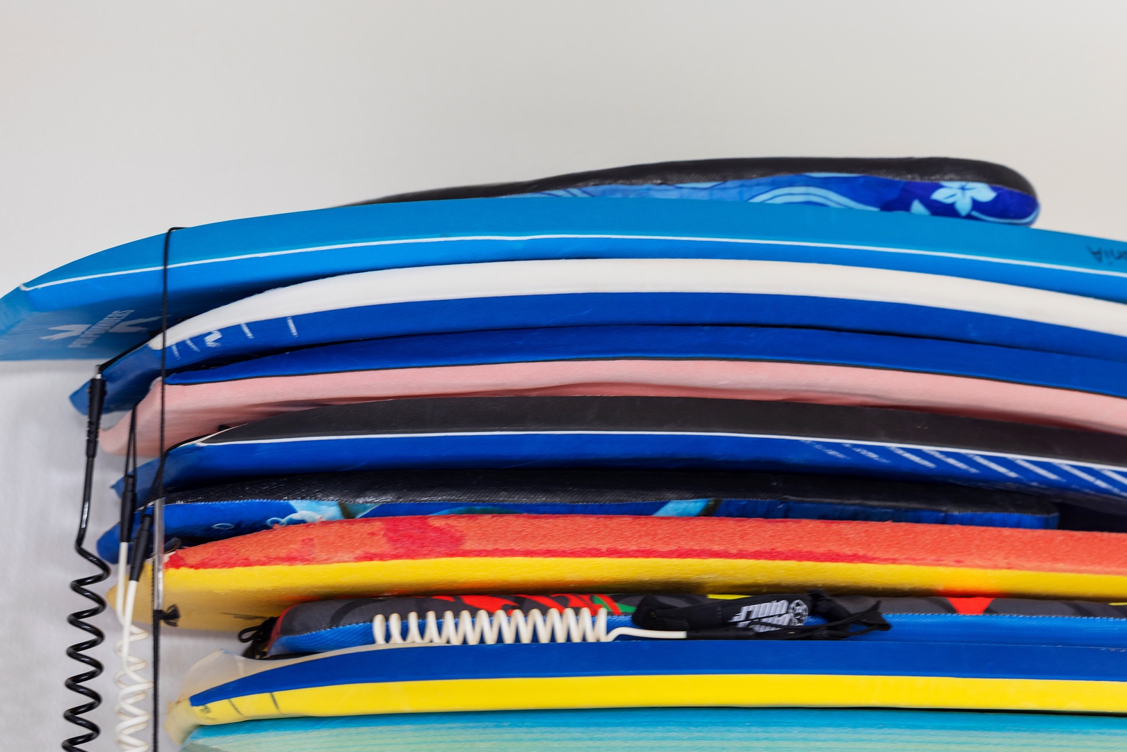 Kapolei Vacation Rentals, Ko Olina Kai 1105E - Colorful surfboards stacked neatly and ready for your next adventure on the waves, from beginner-friendly soft-tops to sleek performance boards.