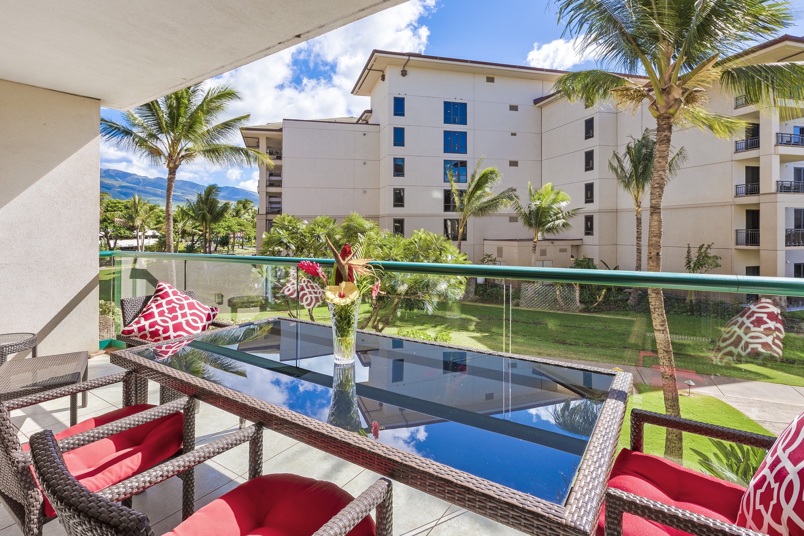 Lahaina Vacation Rentals, Honua Kai Hokulani 214 - Relax and enjoy a meal or drinks on the spacious lanai, surrounded by lush greenery and the tranquil atmosphere of the resort.