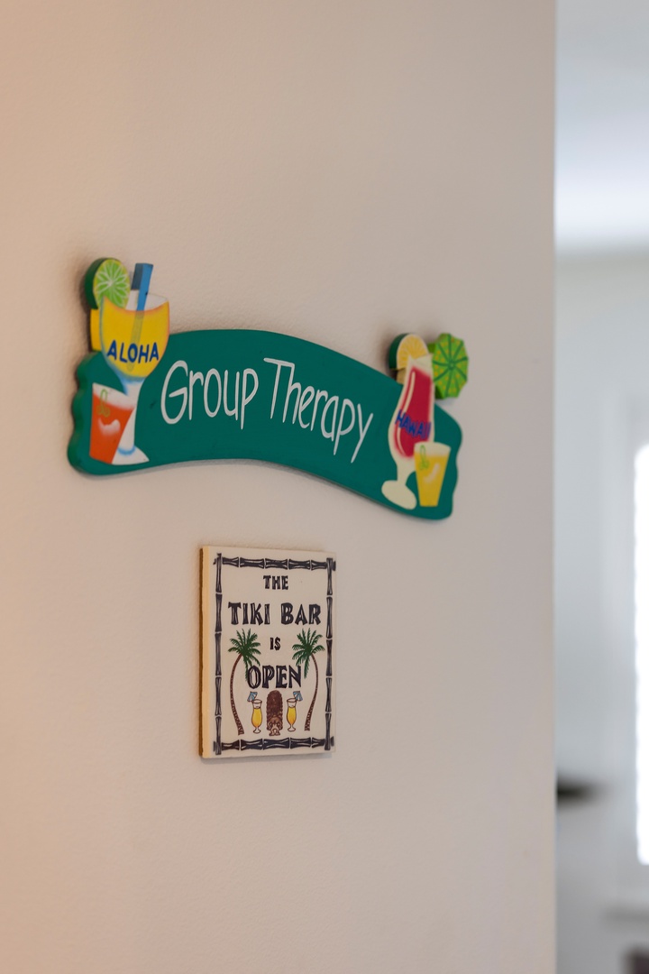 Kapolei Vacation Rentals, Ko Olina Kai 1105E - Playful tropical-themed signs mark a space for shared experiences and relaxation—perfect for gathering with friends or family during your stay.