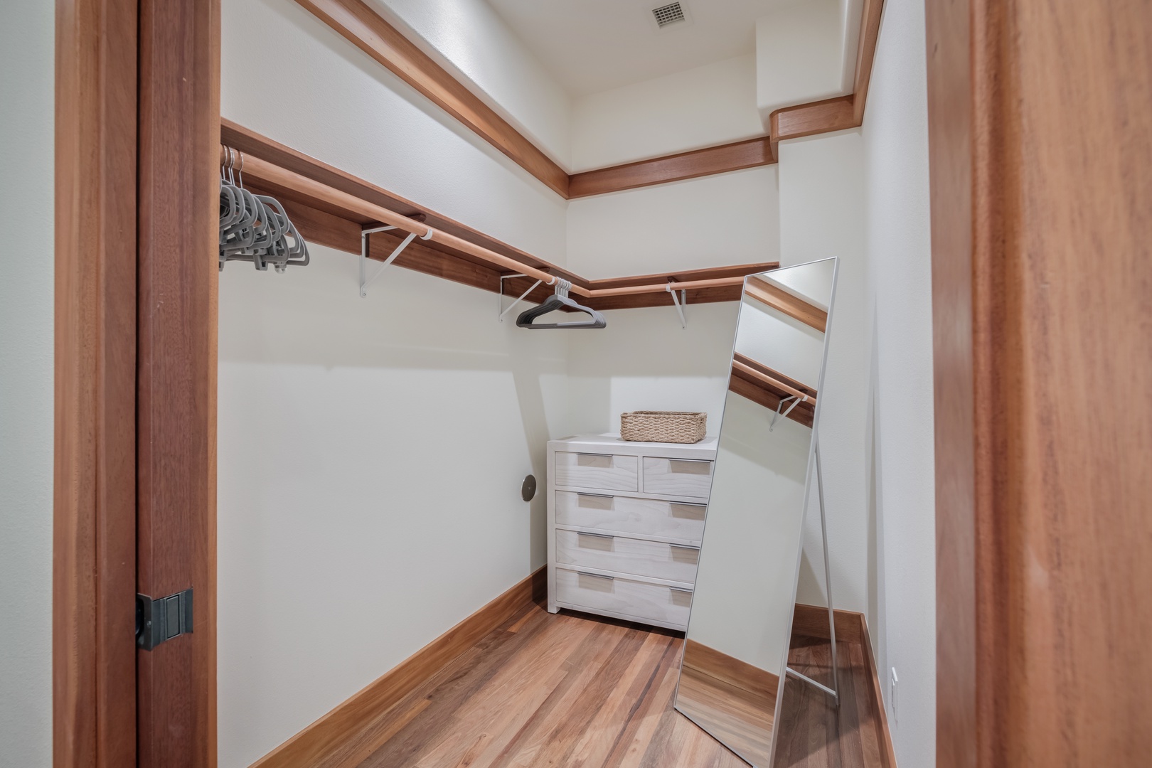 Kamuela Vacation Rentals, Champion Ridge Elegance - Guest Suite 2 spacious walk-in closet with a full-length mirror, dresser and plenty of space.