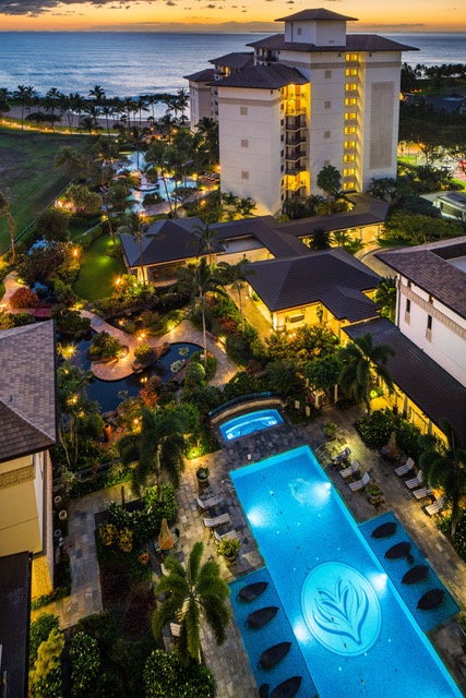 Kapolei Vacation Rentals, Ko Olina Beach Villas O1406 - Lanai view of the resort pool at night.