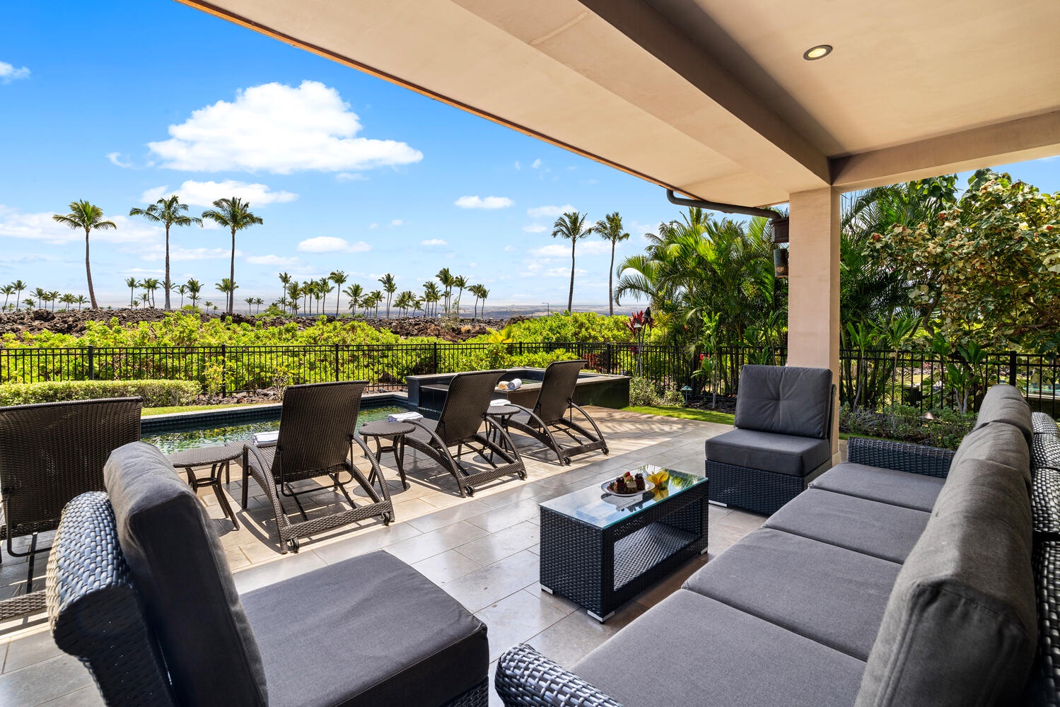 Kamuela Vacation Rentals, Laule'a Ohana Retreat - Covered lanai with outdoor dining and lounge seating overlooking the fairway at Laule'a #14.