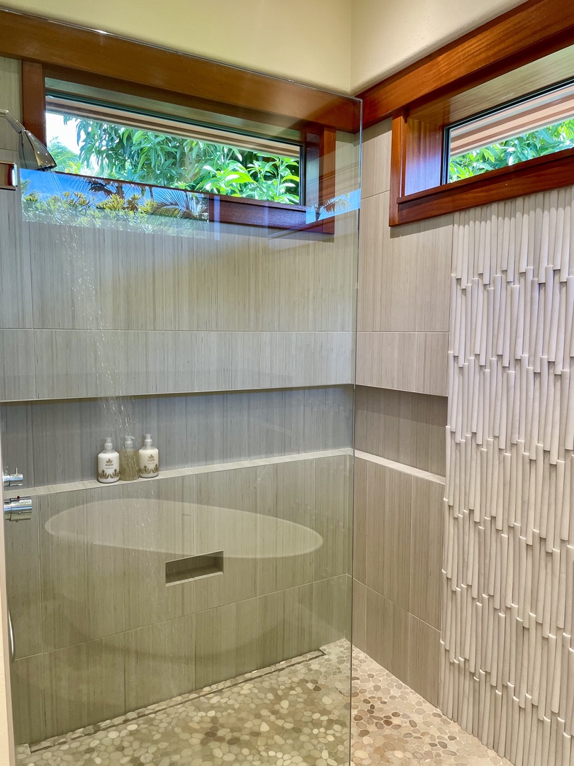 Kamuela Vacation Rentals, Champion Ridge Oasis - Primary ensuite bathroom sumptuous soaking tub with textured tile details creating a serene ambiance.