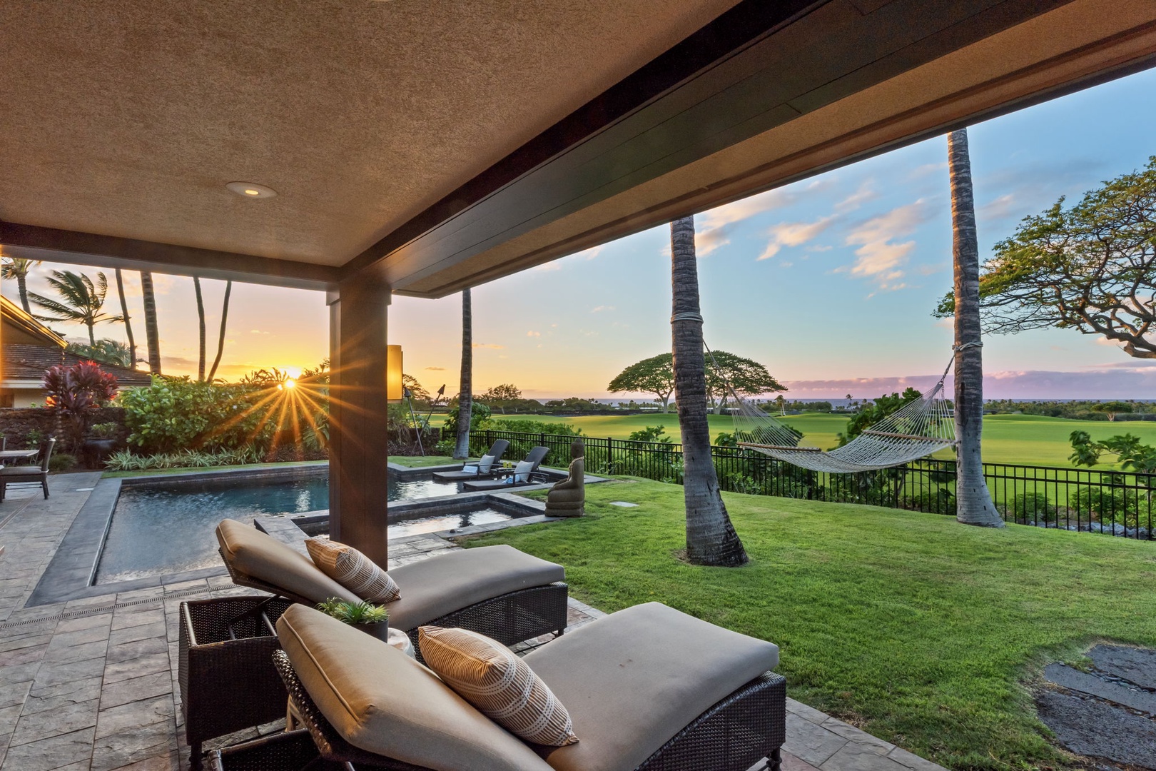 Kailua Kona Vacation Rentals, 3BD Pakui Street Estate (149) at Hualalai Resort - Golden hour reaches the covered lanai, the lawn glowing all the way to the fairway.