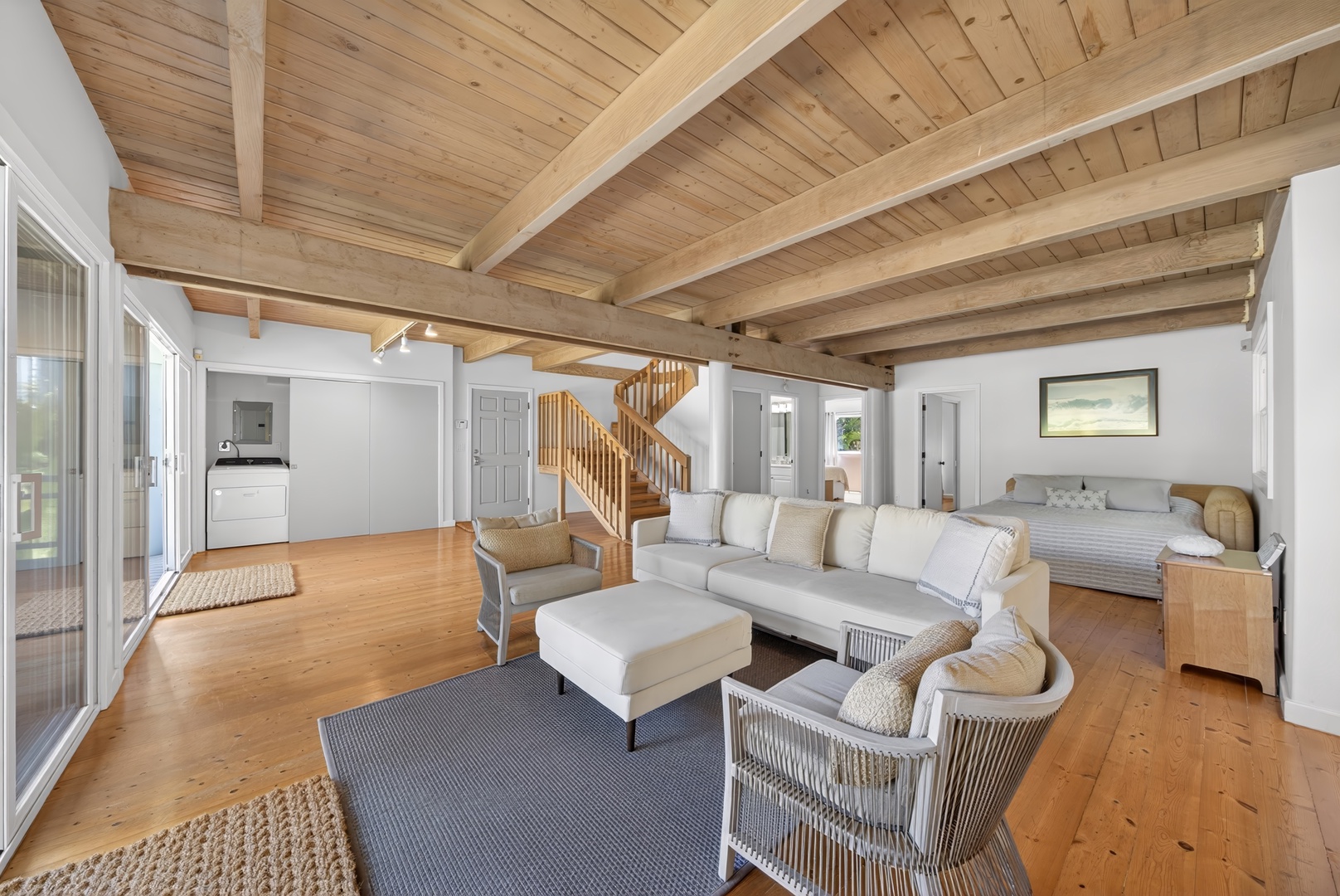 Haleiwa Vacation Rentals, Sunset Beach Hideaway - Relax in your open-concept retreat with vaulted wood ceilings, cozy seating, and a sleeping area that blends comfort with coastal charm.