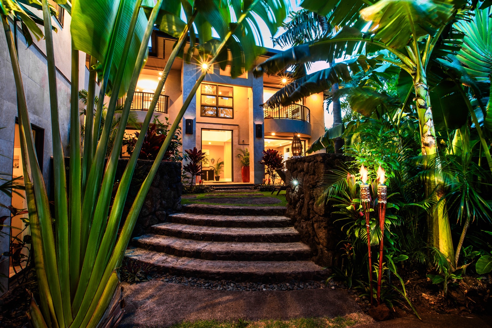Honolulu Vacation Rentals, Pili Pono - Stone path entry illuminated by soft tropical lighting.
