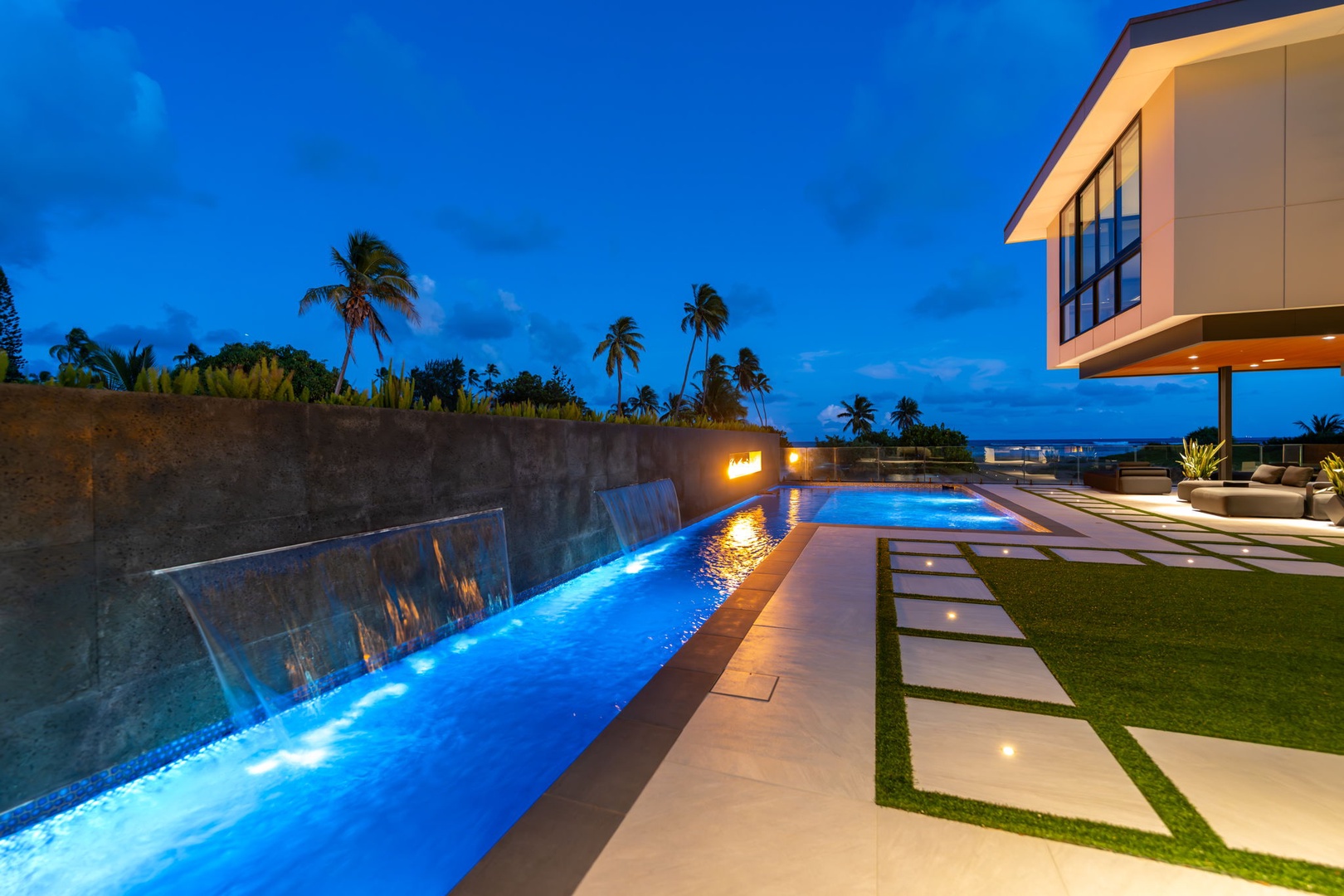 Honolulu Vacation Rentals, Ocean Villa Emilie - The dramatic edge-lit lap pool invites you to glide through water with a view of the Pacific beyond.