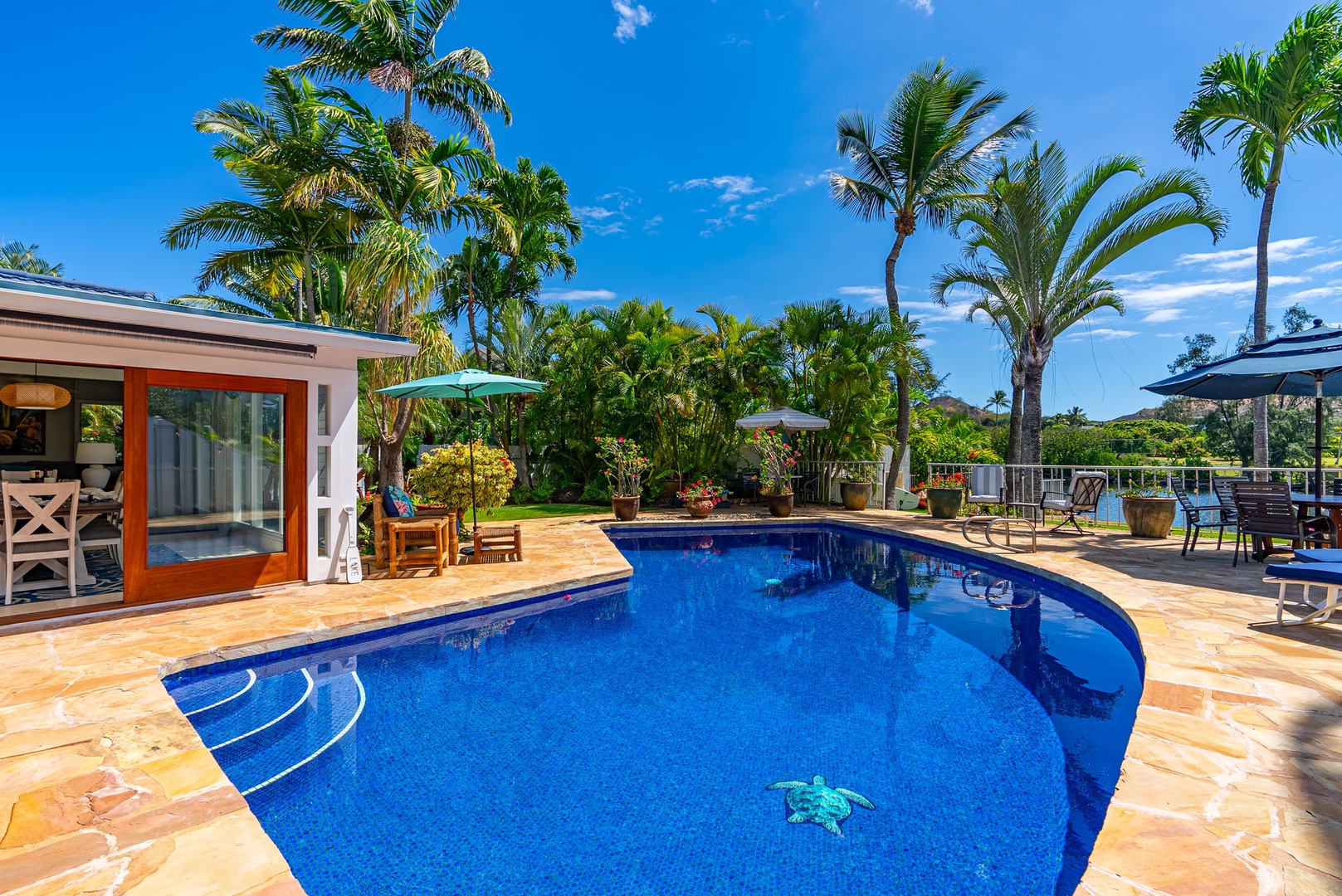 Kailua Vacation Rentals, Hale Aloha - Dive into the inviting waters of the pool, adorned with shimmering blue tiles.