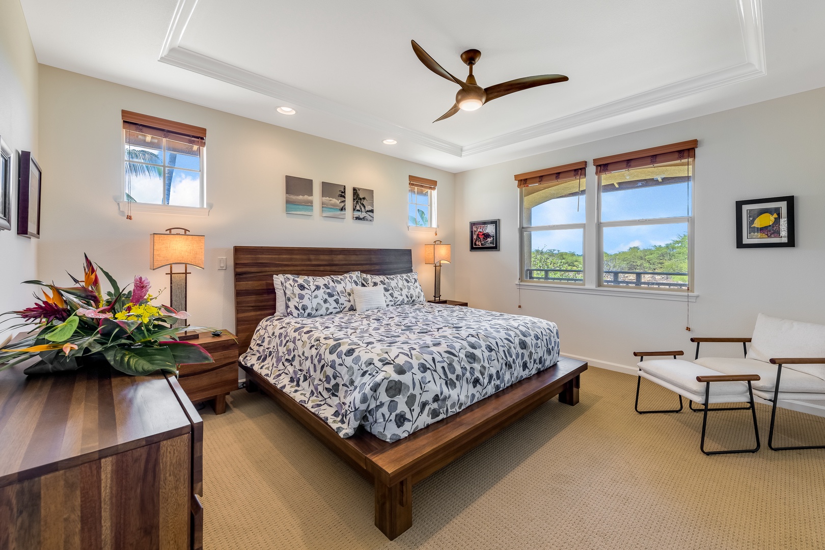Kamuela Vacation Rentals, Mauna Lani Fairways #603 - The primary suite boasts a plush king bed with views of nature