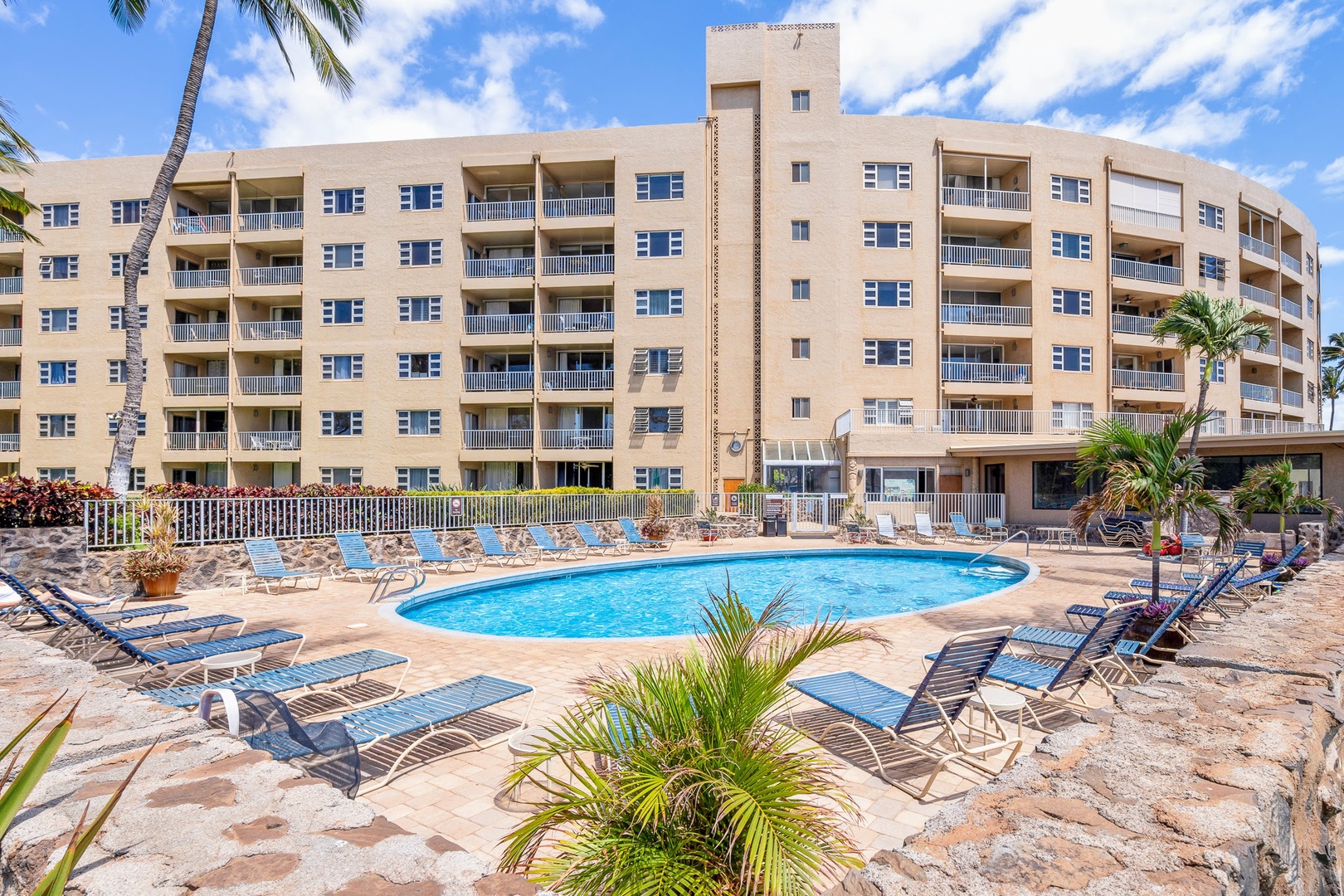 Kihei Vacation Rentals, Menehune Shores 316 - Blue loungers ring the pool, a shorter walk than the beach for anyone who wants both.