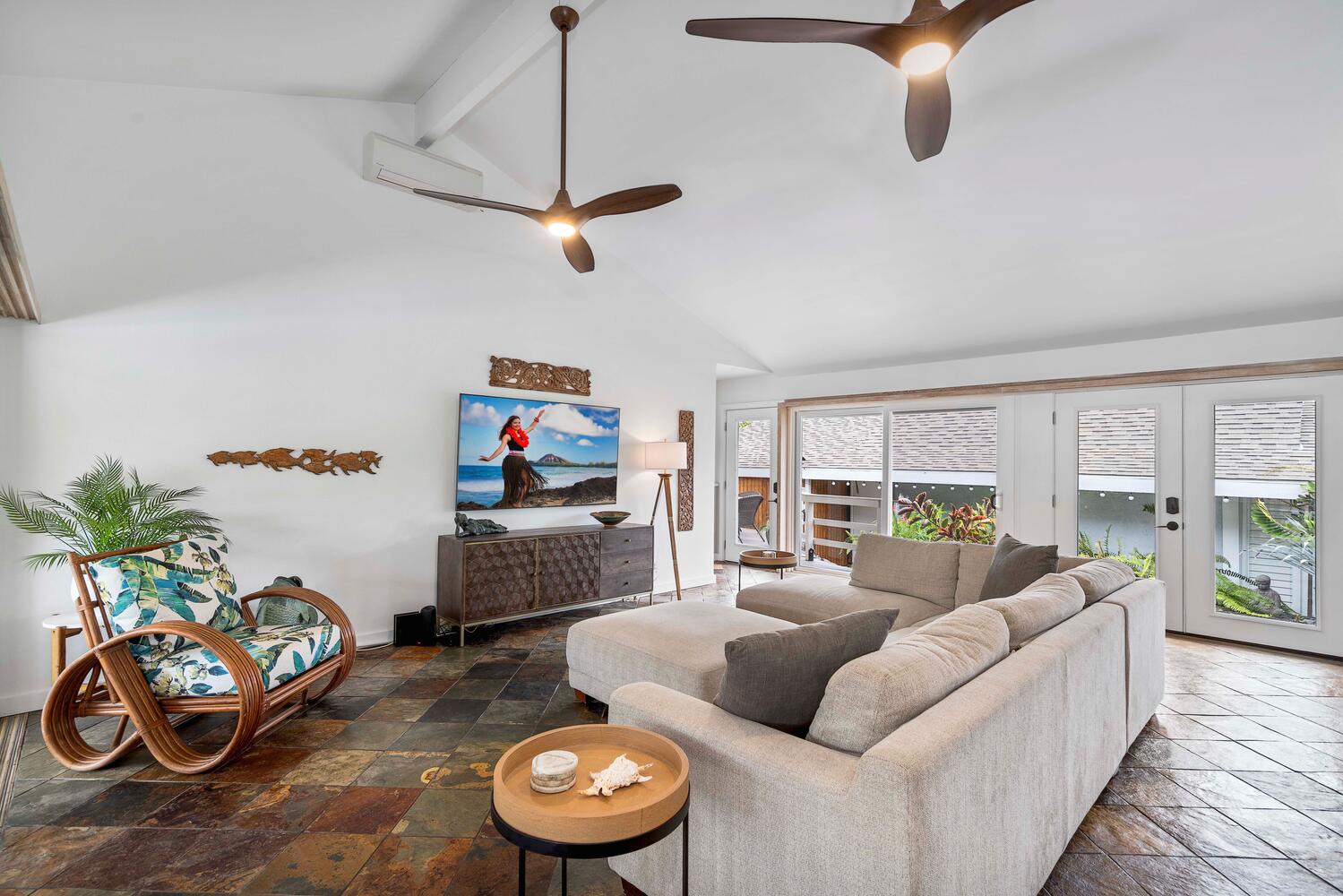 Kailua Kona Vacation Rentals, Manukai Hale - Gather and lounge in the living area with plush sectional sofa, TV and ceiling fan.