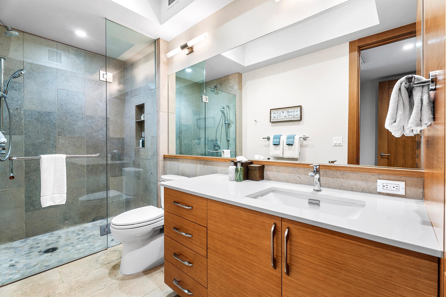 Kamuela Vacation Rentals, Laule'a Ohana Retreat - Spacious ensuite bathroom with glass walk-in shower and double vanity at Laule'a #14.