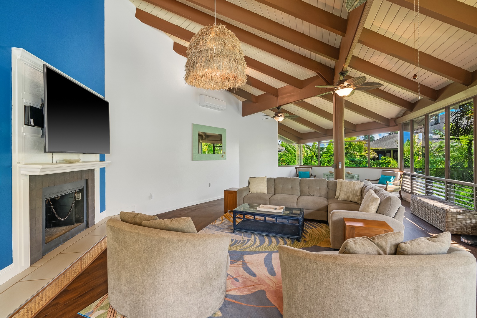 Princeville Vacation Rentals, Mauna Kai 7B - Movie night gathers around the fireplace and the wall-mounted TV.