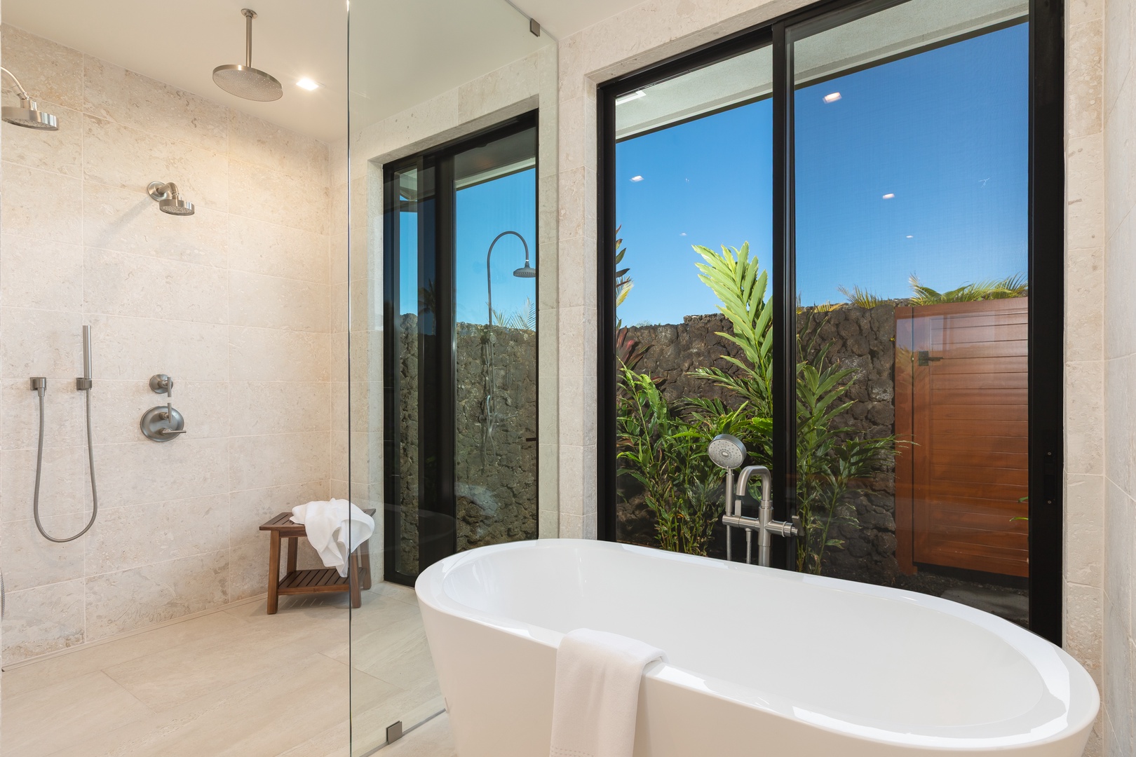 Kamuela Vacation Rentals, 5BD Mauna Lani Lux Ocean Estate (OE12) at One Ocean - Soak in your private soaking tub while gazing at lush tropical gardens through floor-to-ceiling windows in this spa-like bathroom sanctuary.