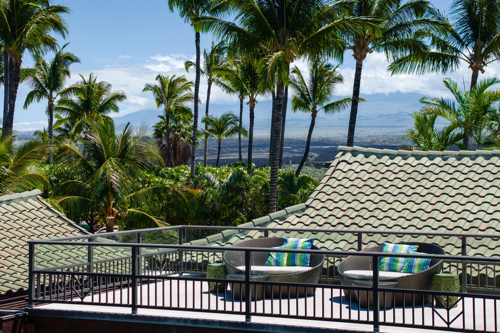 Kamuela Vacation Rentals, Mauna Lani Champion Ridge 22 - Unwind on the rooftop sun beds with sweeping views of the mountains and tropical surroundings.