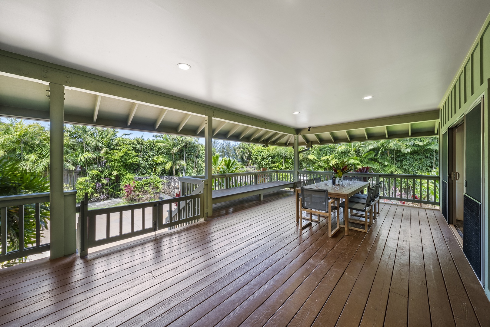 Haleiwa Vacation Rentals, Kaunala Retreat - Second lanai dining space overlooking lush tropical foliage—shaded, breezy, and serene.