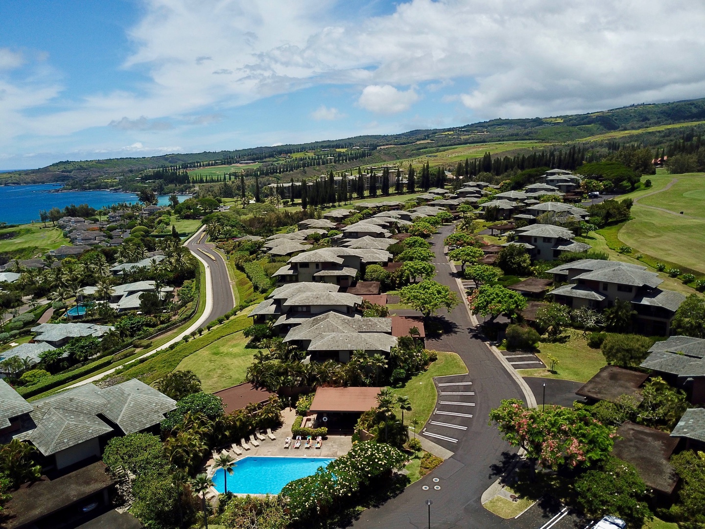 Lahaina Vacation Rentals, Kapalua Ridge 1622 - An aerial view showcasing the serene neighborhood, complete with lush greenery and a community pool for relaxation.