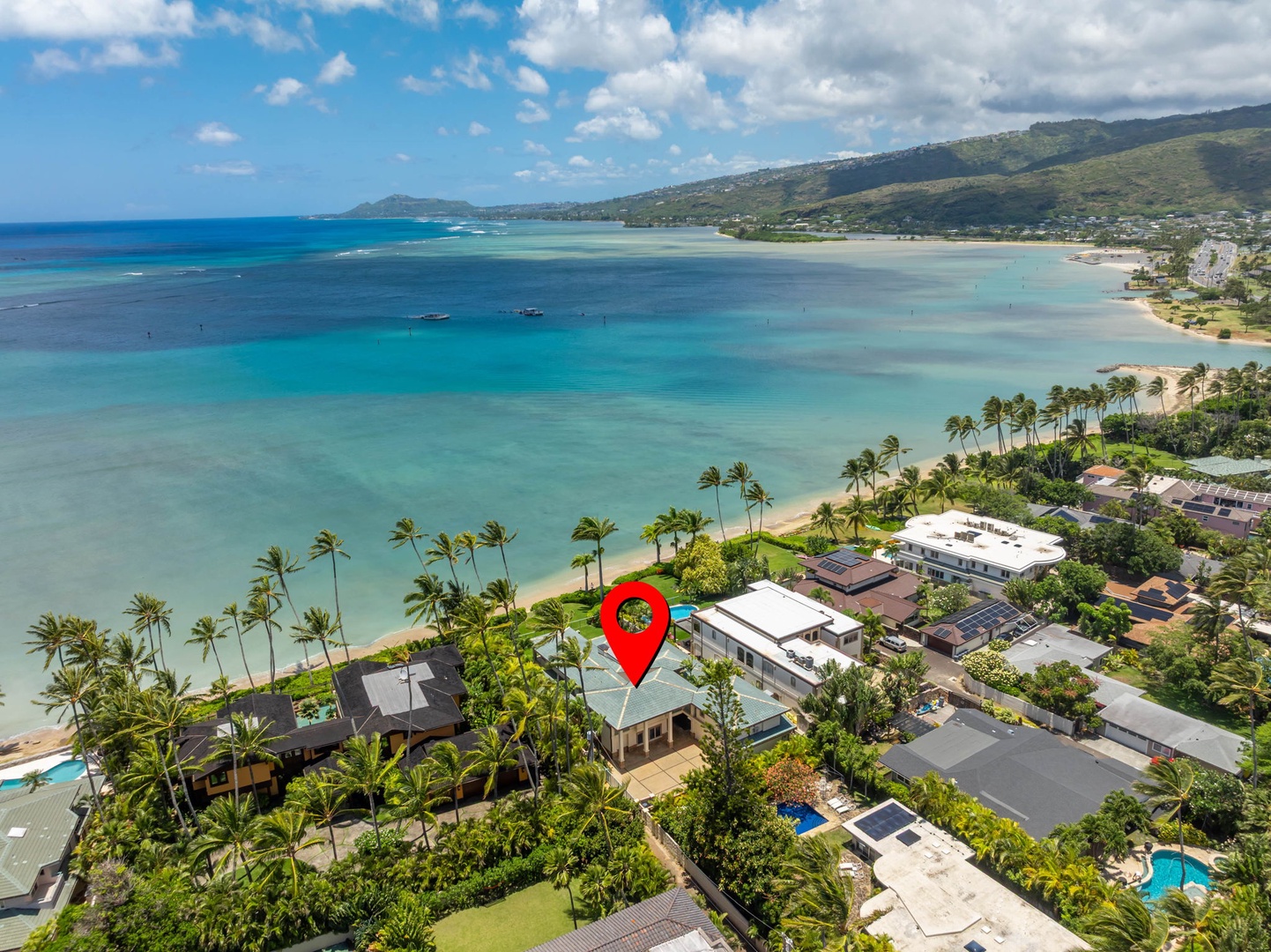 Honolulu Vacation Rentals, Maunalua Estate - Palm-lined beaches, sparkling blue water, and rolling green hills surround this peaceful oceanfront setting.