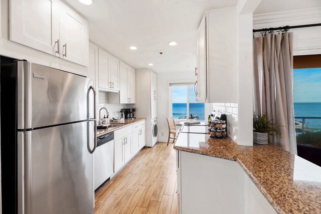 La Jolla Vacation Rentals, Oceanfront La Jolla Cove Condo - The updated kitchen features European design and all new appliances, including a washer/dryer tucked away near the breakfast nook.