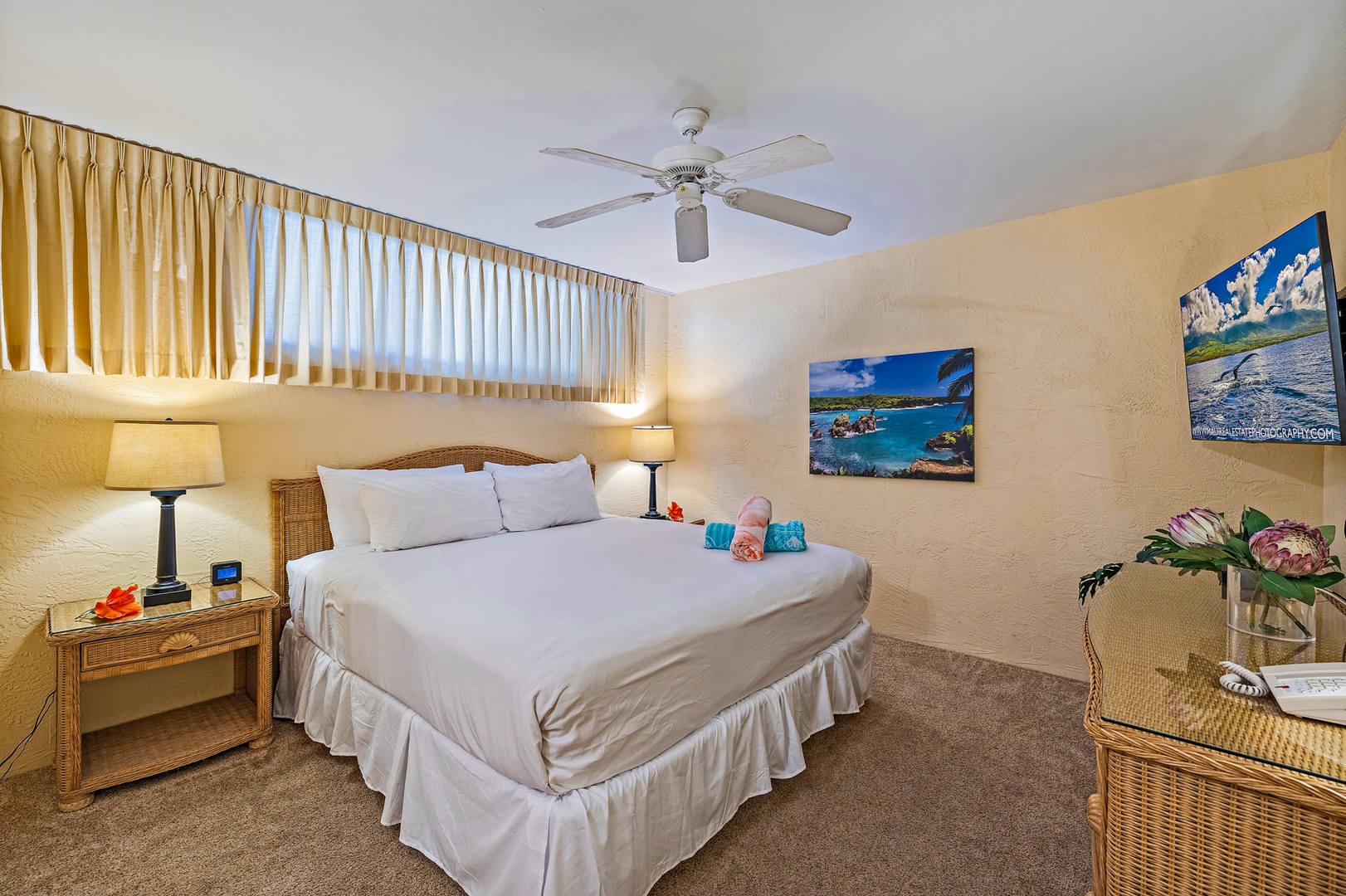 Lahaina Vacation Rentals, Papakea G-306 - The cozy bedroom features a plush king-sized bed and ceiling fan, providing a peaceful retreat for a restful night's sleep.