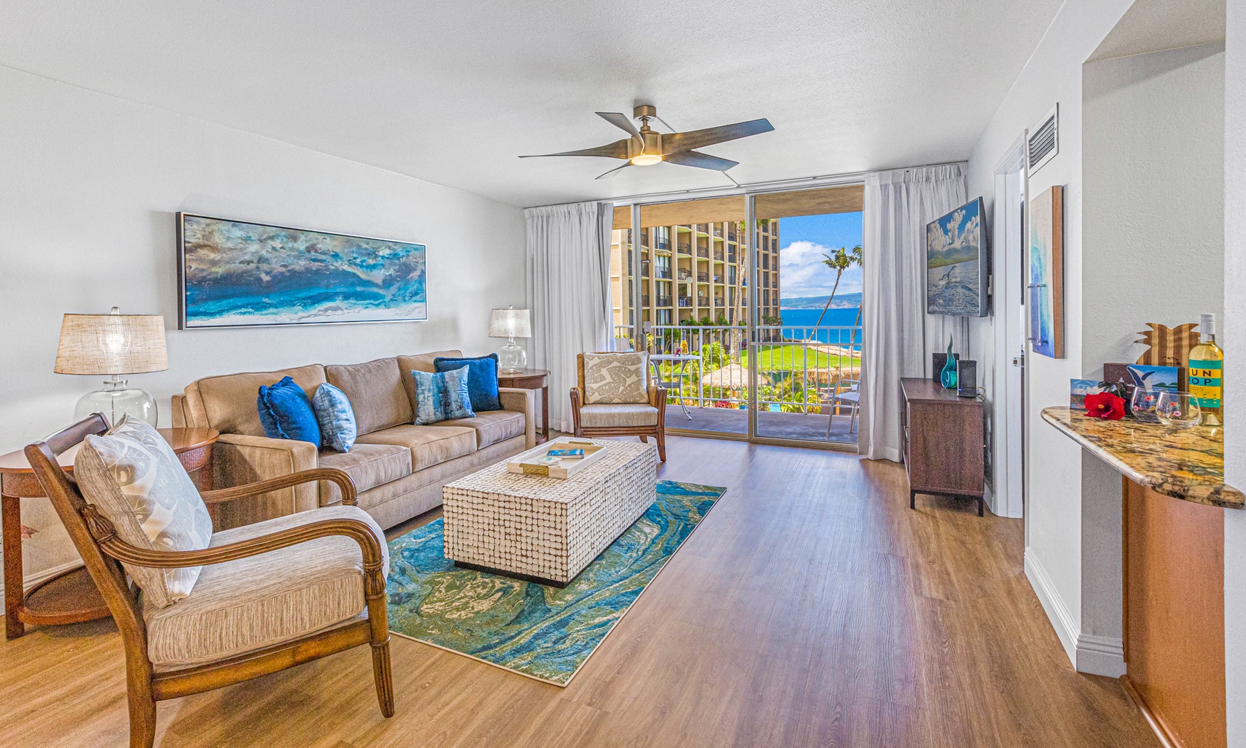 Lahaina Vacation Rentals, Royal Kahana 213 - Relax in the comfortable living room with direct access to the lanai, offering beautiful views of the ocean and resort grounds.