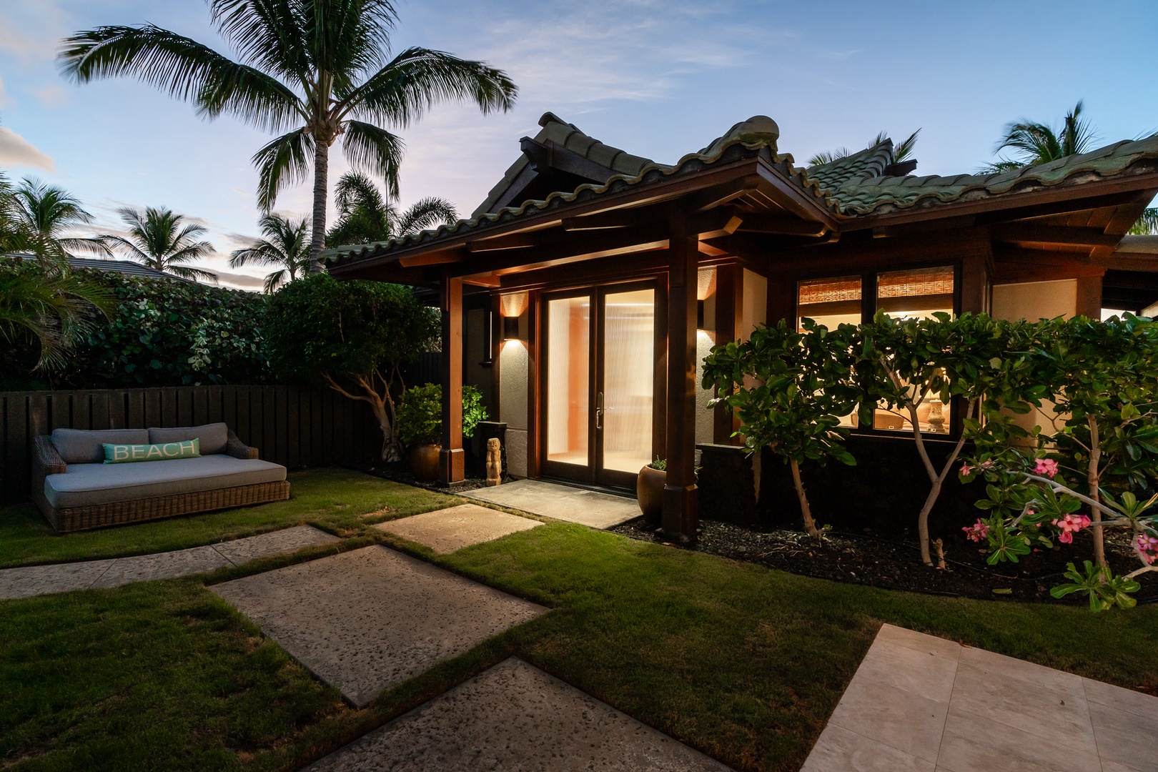 Kamuela Vacation Rentals, Mauna Lani Champion Ridge 22 - Relax and unwind in this peaceful outdoor space as the evening sets in.