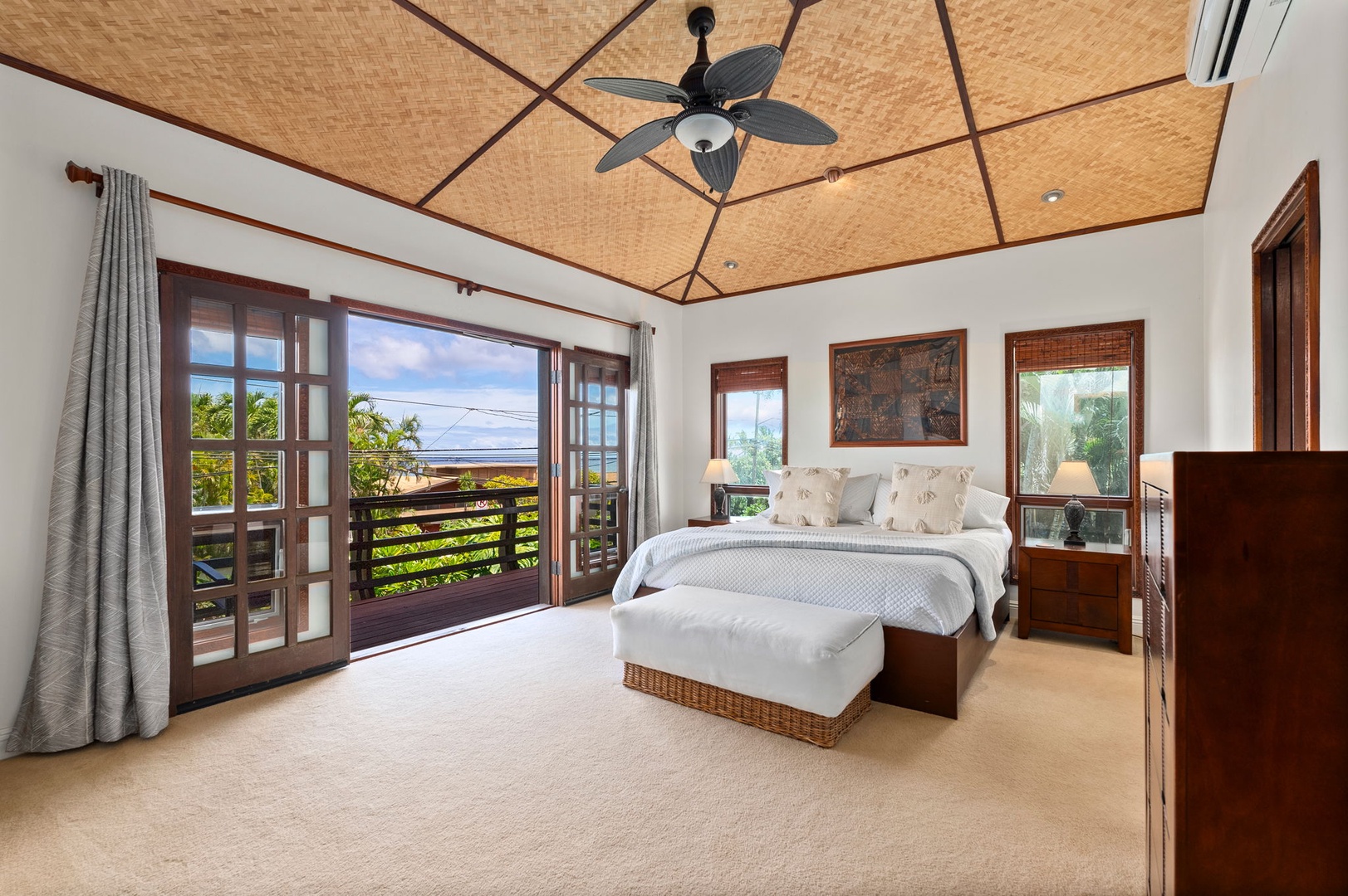 Haleiwa Vacation Rentals, Kealoha Tropical Beach Villa - The primary suite in the upper-level features a king-sized bed, split AC, ceiling fan and views from the private deck.