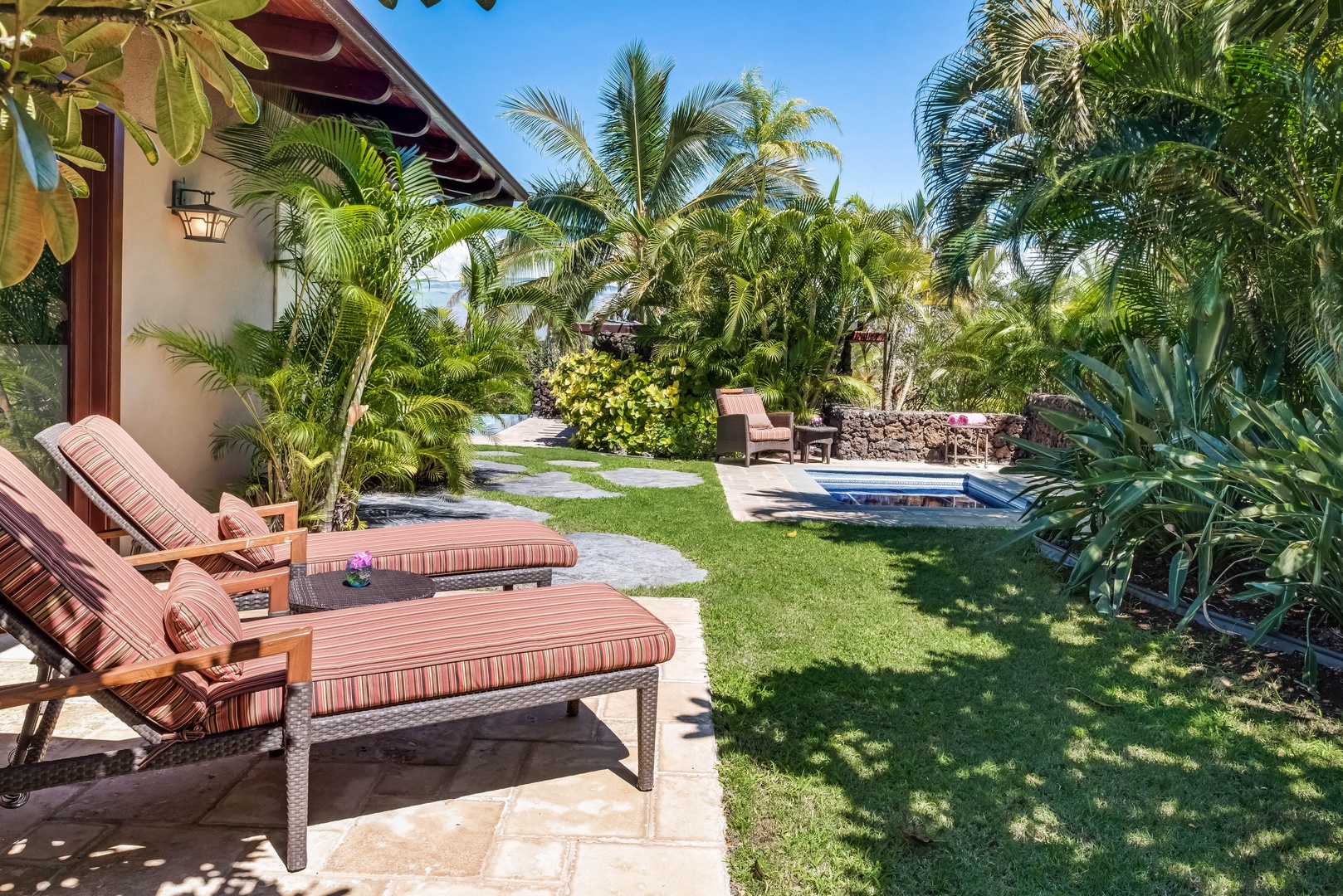 Kamuela Vacation Rentals, House of the Turtle at Champion Ridge, Mauna Lani (CR 18) - Right outside the primary suite are the loungers right the sunken spa, a perfect spot to unwind and relax.