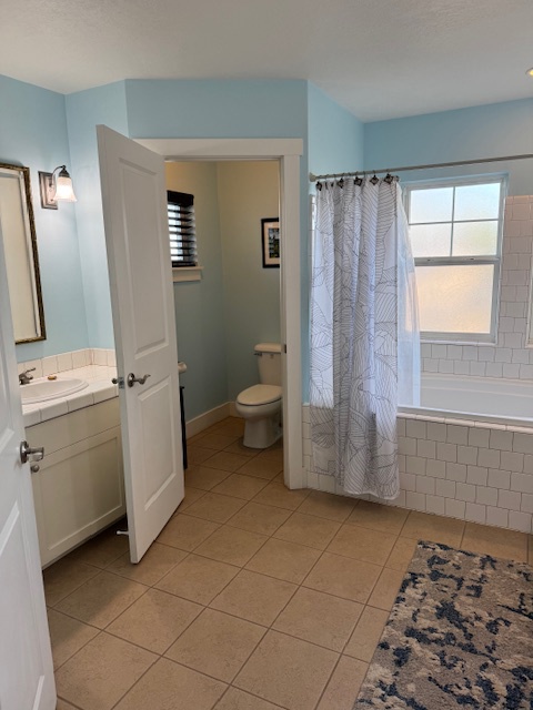 Princeville Vacation Rentals, Pili Aloha - Bright bathroom with a shower and plenty of natural light.