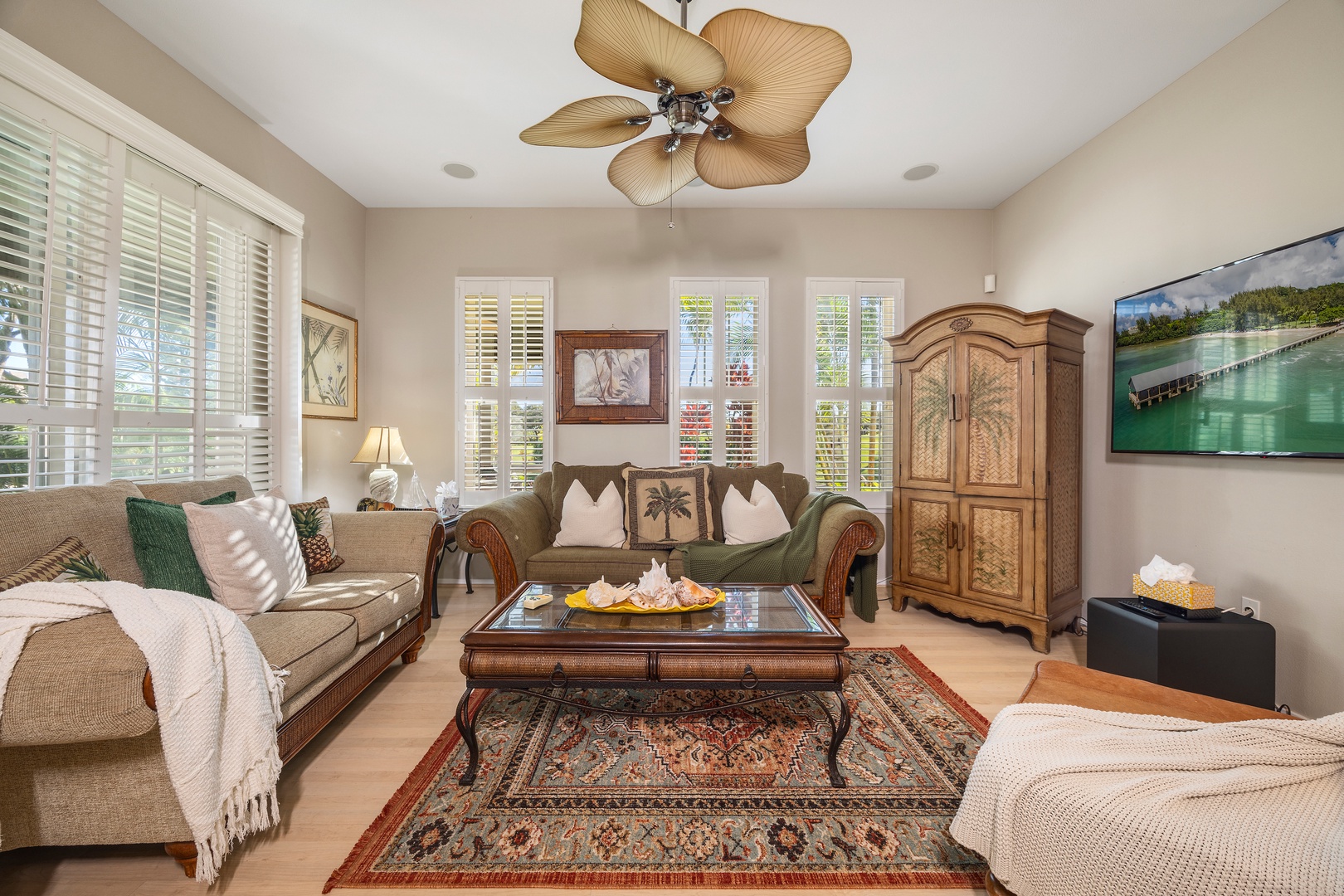 Sink into plush sofas where tropical-themed décor and warm lighting create your perfect retreat for evening relaxation.