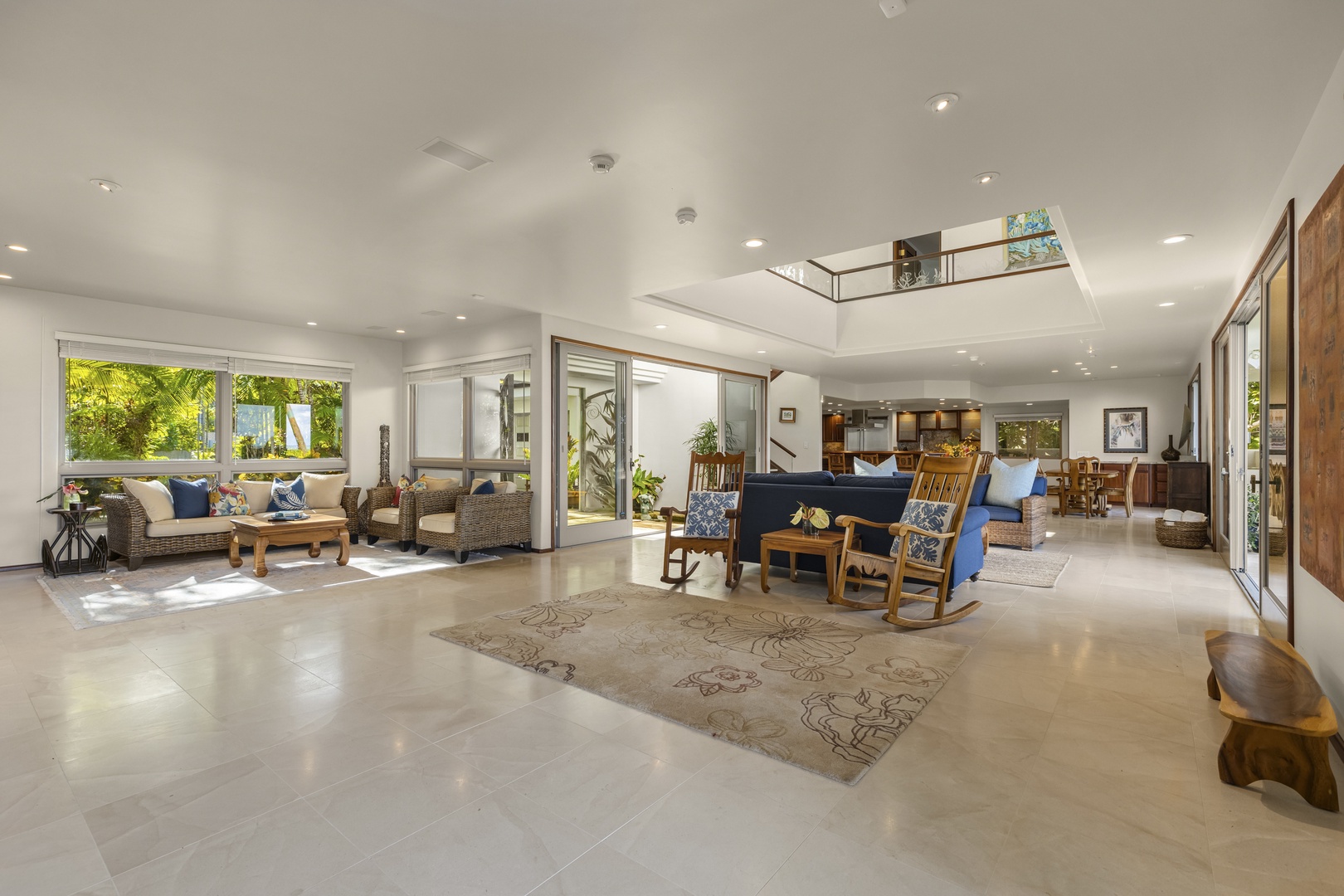 Kailua Vacation Rentals, Mokulua Sunrise - A sitting area situated under the central landing is a great place to enjoy the energy of the house, as the views of the ocean outside and comfortably cushioned seating entice you to relax.