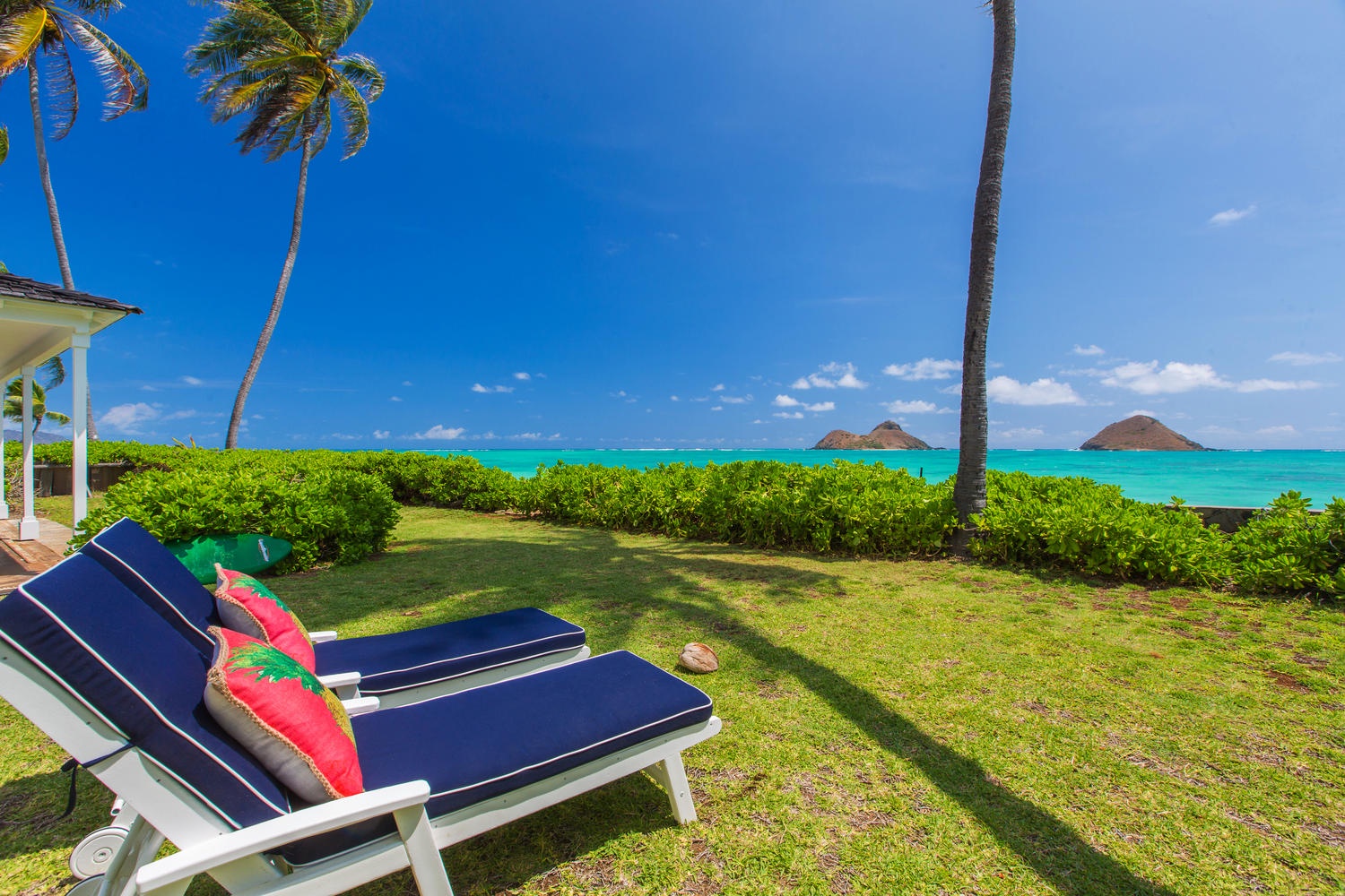 Kailua Vacation Rentals, Lanikai Oceanside 5 Bedroom - Chaise lounge chairs in back yard with views of the Molulua Islands