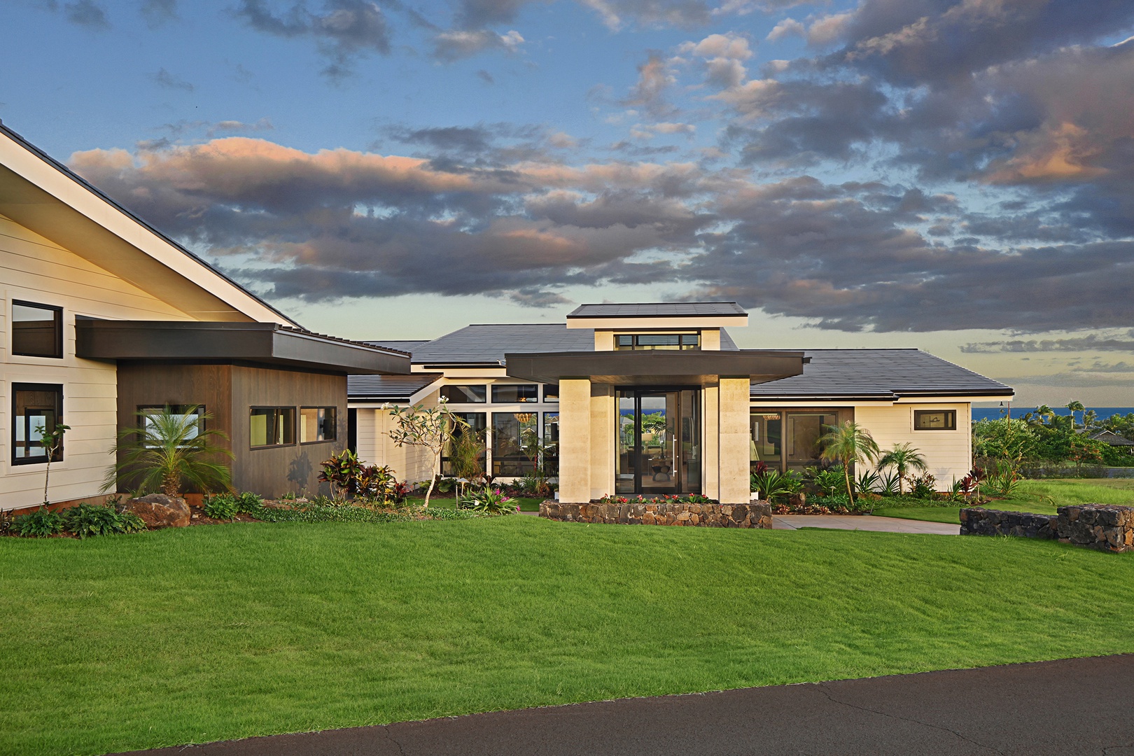 Koloa Vacation Rentals, Hale Mahina Hou - Inviting front view of the house radiates elegance and charm with its intricate details.