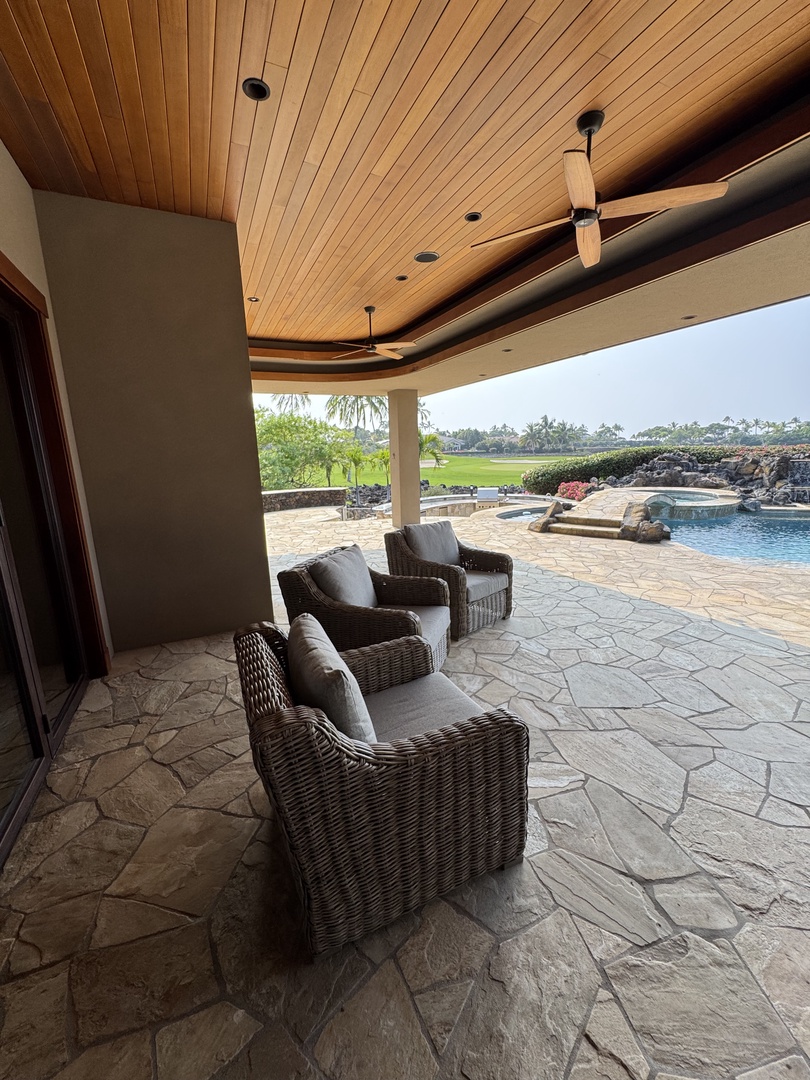 Kamuela Vacation Rentals, Hale Konane - Covered outdoor lounge with plush seating, ideal for relaxing by the pool.