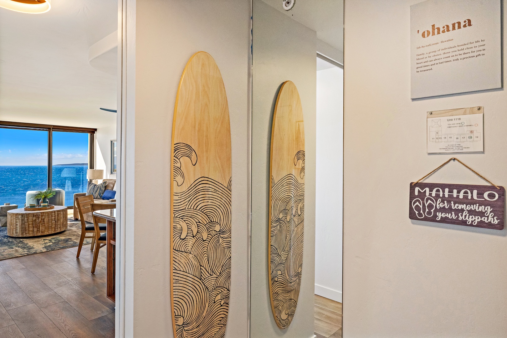 Lahaina Vacation Rentals, Mahana 1118 - A beautifully crafted surfboard art piece adorns the hallway, offering a touch of coastal charm and bringing the island vibe indoors