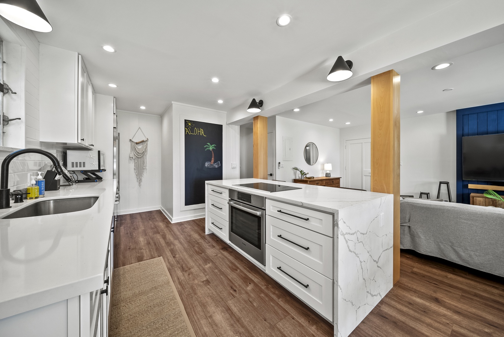 Honolulu Vacation Rentals, Honolulu Beachfront Retreat - Sleek open kitchen with a spacious layout, where guests can easily flow between relaxing and dining after beachside adventures.