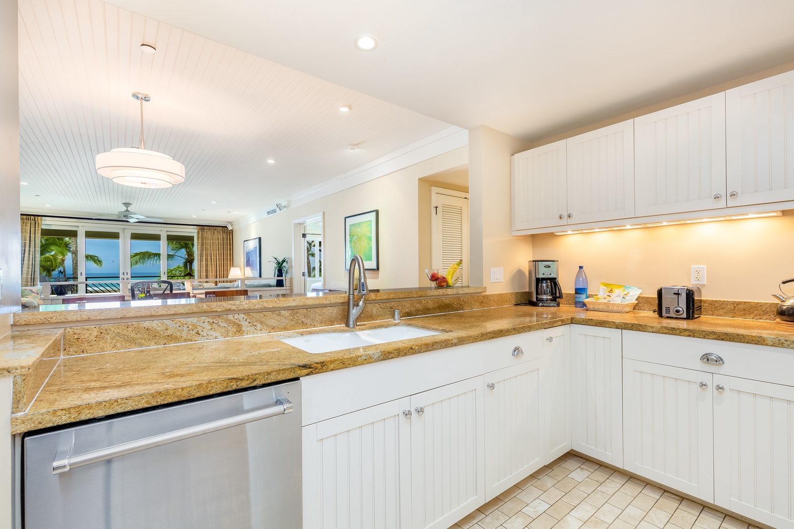 Kahuku Vacation Rentals, OFB Turtle Bay Villas 301 - The updated kitchen features all of the appliances you’ll need to recreate your favorite meals and the high ceilings and fine finishes like Brazilian chestnut floors and granite and marble countertops throughout offer the perfect setting for your at-home 