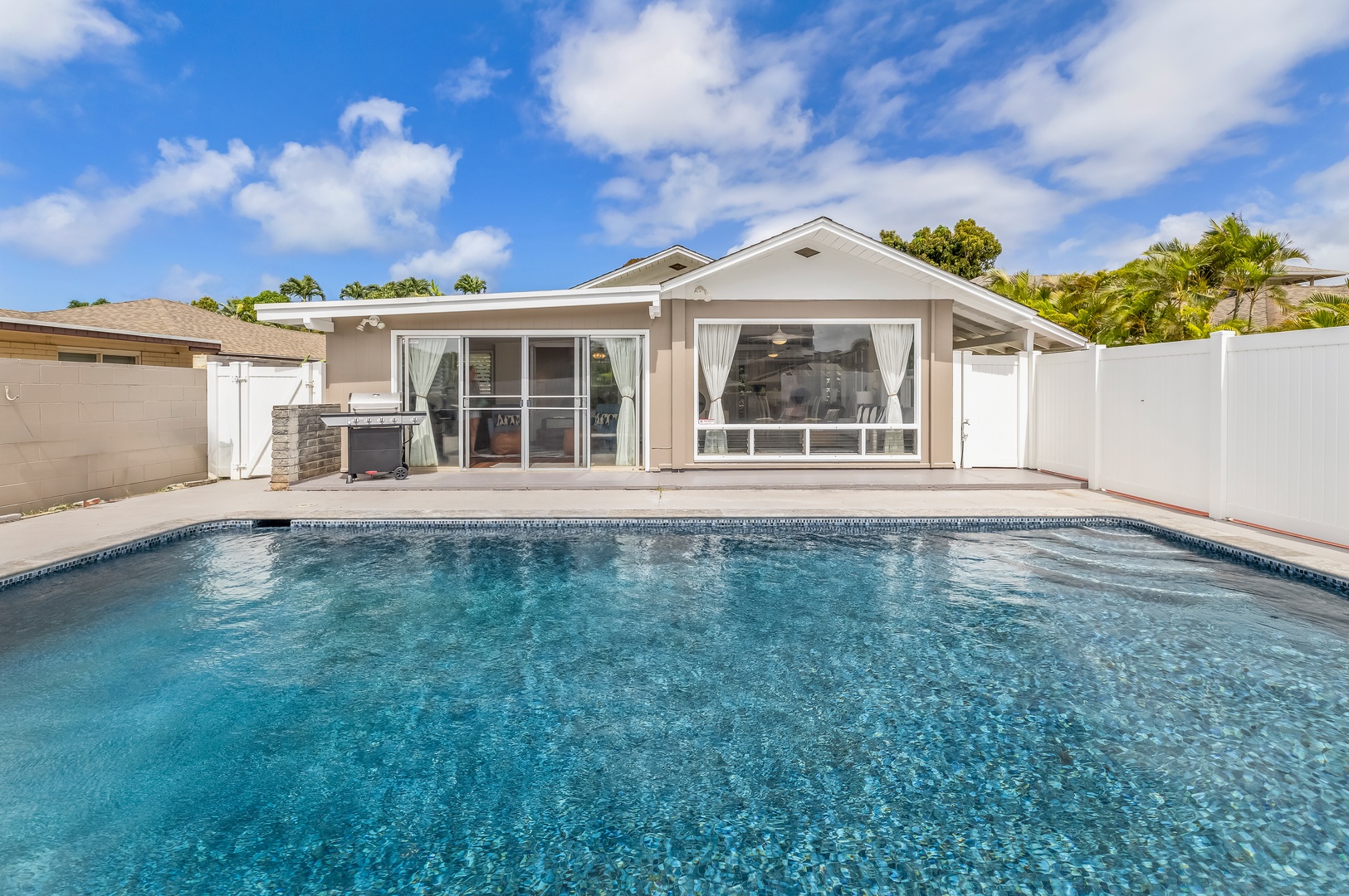 Honolulu Vacation Rentals, Kahala Cottage - The lanias surround the private pool.