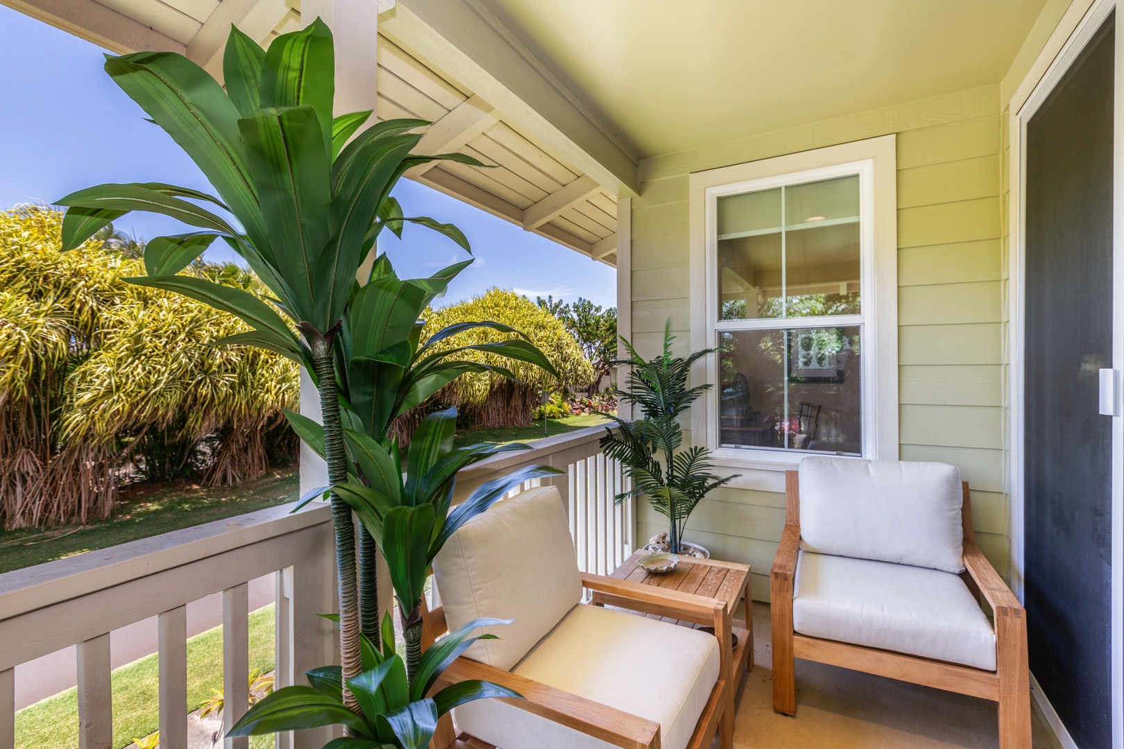 Princeville Vacation Rentals, Pualani Villa - Relax on the private lanai, surrounded by tropical plants and fresh island air.