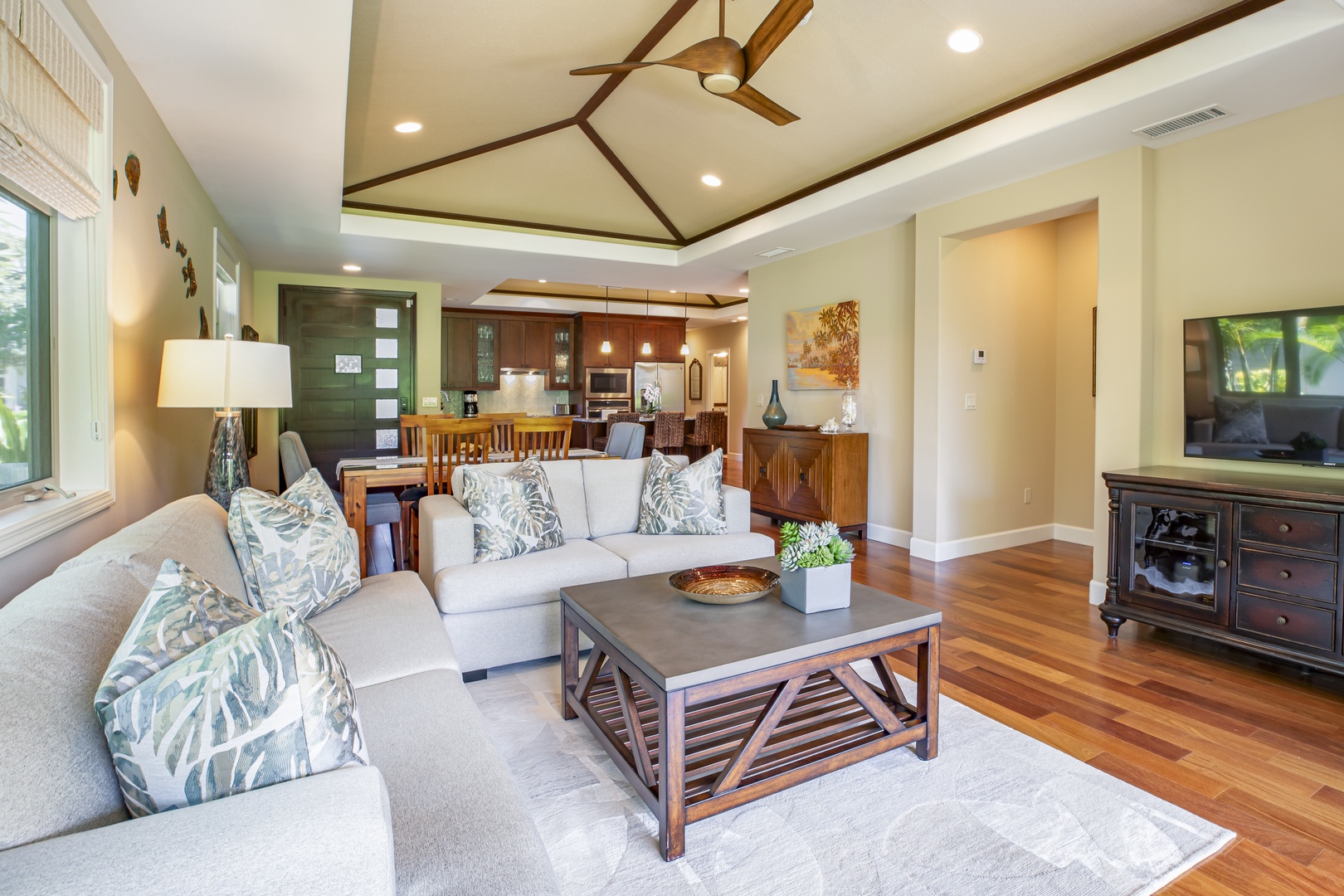 Kamuela Vacation Rentals, Mauna Lani KaMilo #503 - Gather in the open-concept living room, where vaulted ceilings and stylish island décor create an inviting retreat.